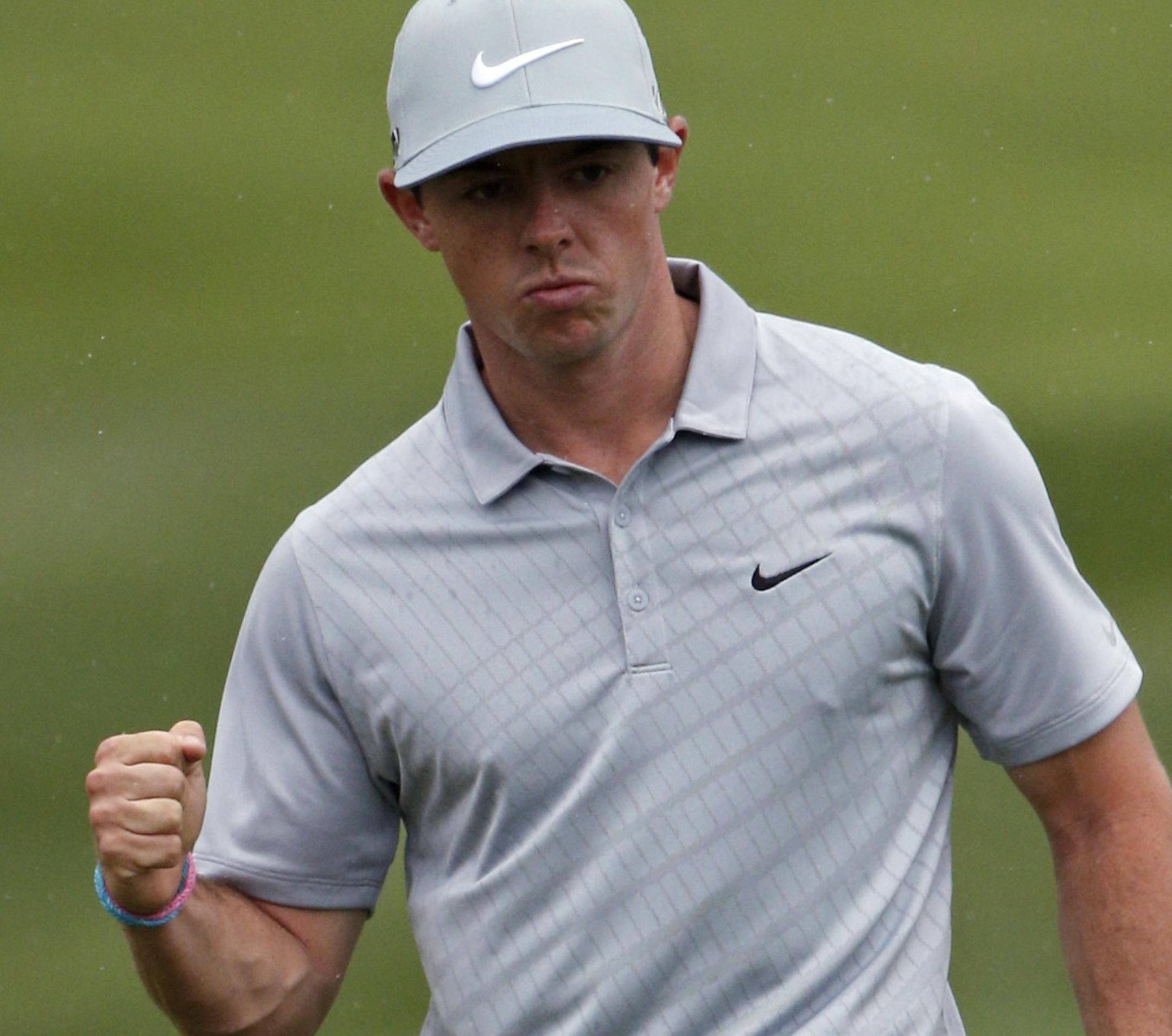 Rory McIlroy, of Northern Ireland, celebrates an eagle on the 18th hole during the second round of the PGA Championship golf tournament at Valhalla Golf Club on Friday, Aug. 8, 2014, in Louisville, Ky. (AP Photo/Mike Groll)