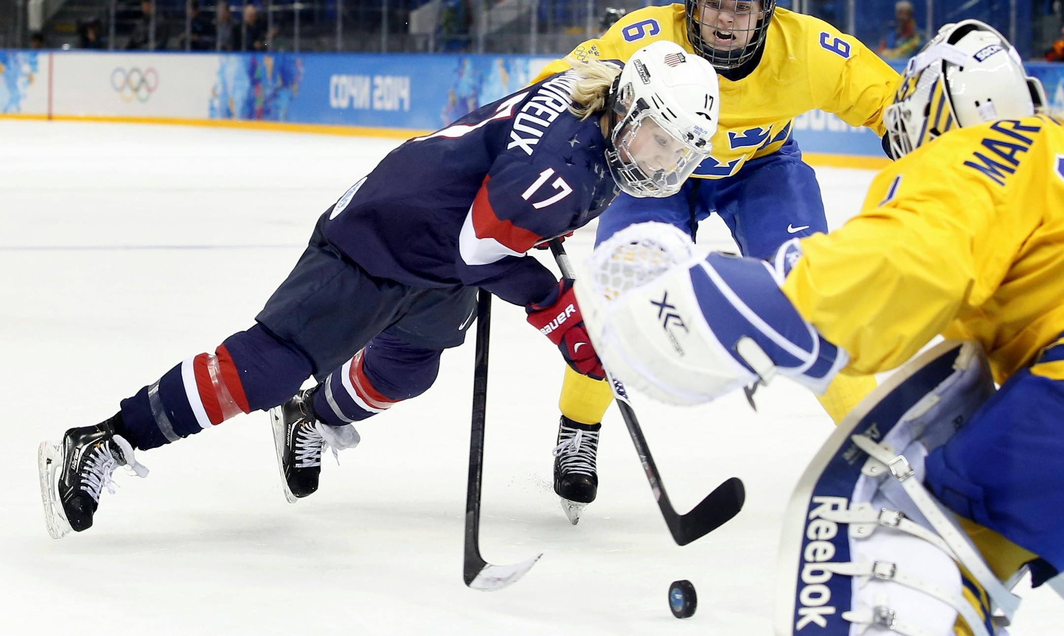 Jocelyne Lamoureux (17) was tripped up on this play in the third period resulting in a penalty shot. USA beat Sweden by a final score of 6-1.