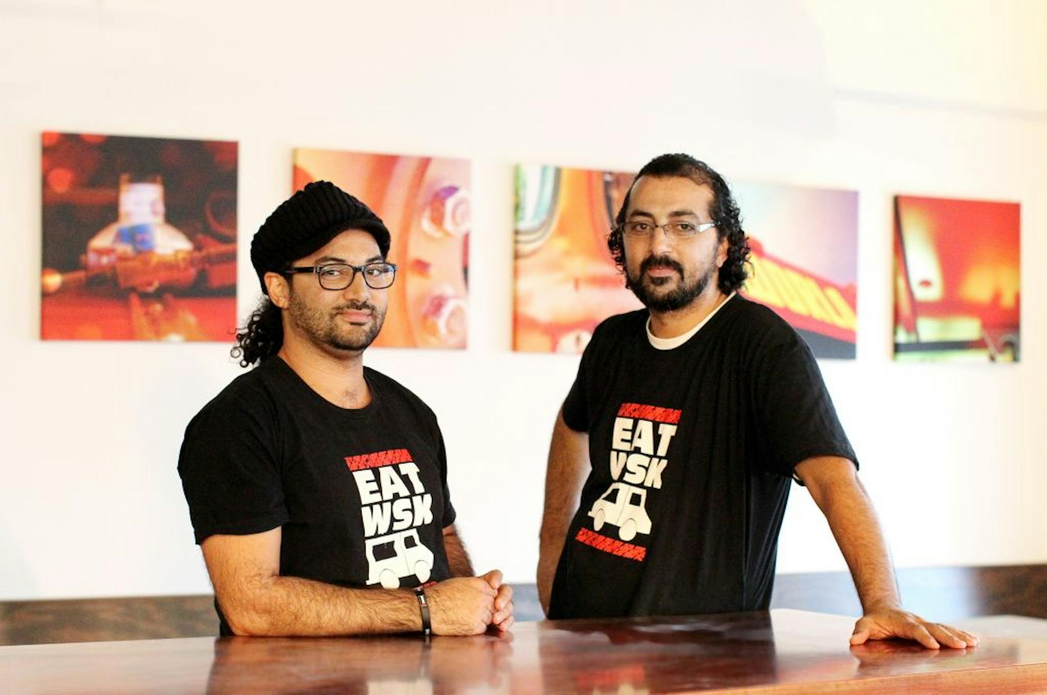WSK co-owners (and siblings) Sameh, left, and Saed Wadi at the new World Street Kitchen on Lyndale in Minneapolis November 13, 2012. The pictures hanging on the wall are artistic photos, taken by Saed, showing details of the WSK food truck.
