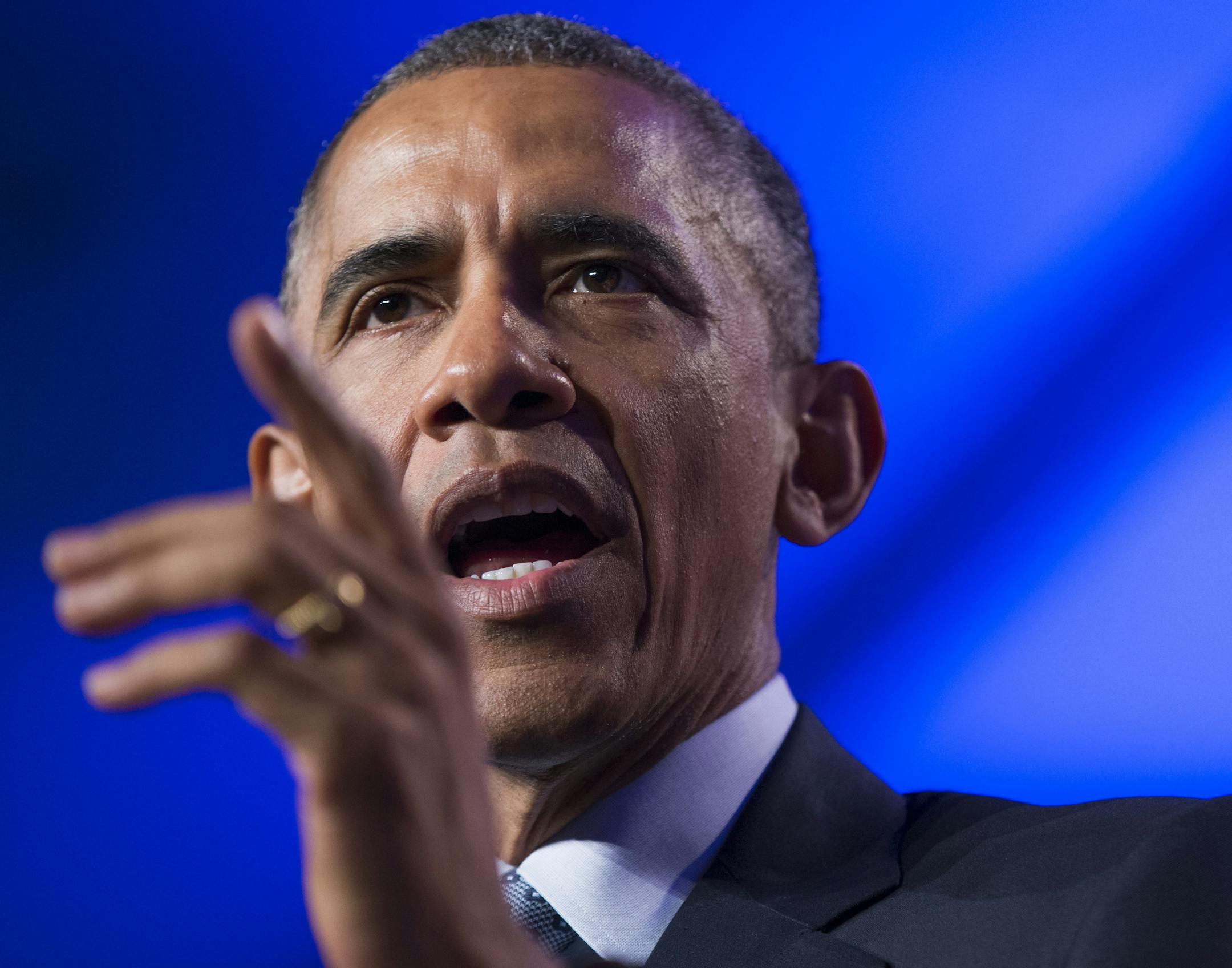 President Barack Obama speaks at the Democratic National Committee winter meeting in Washington, Friday, Feb. 20, 2015. Taunting Republicans, the president said it's "not an accident" that the economy is improving on his watch and that Republicans' "doom and gloom" predictions haven't come true. (AP Photo/Evan Vucci)