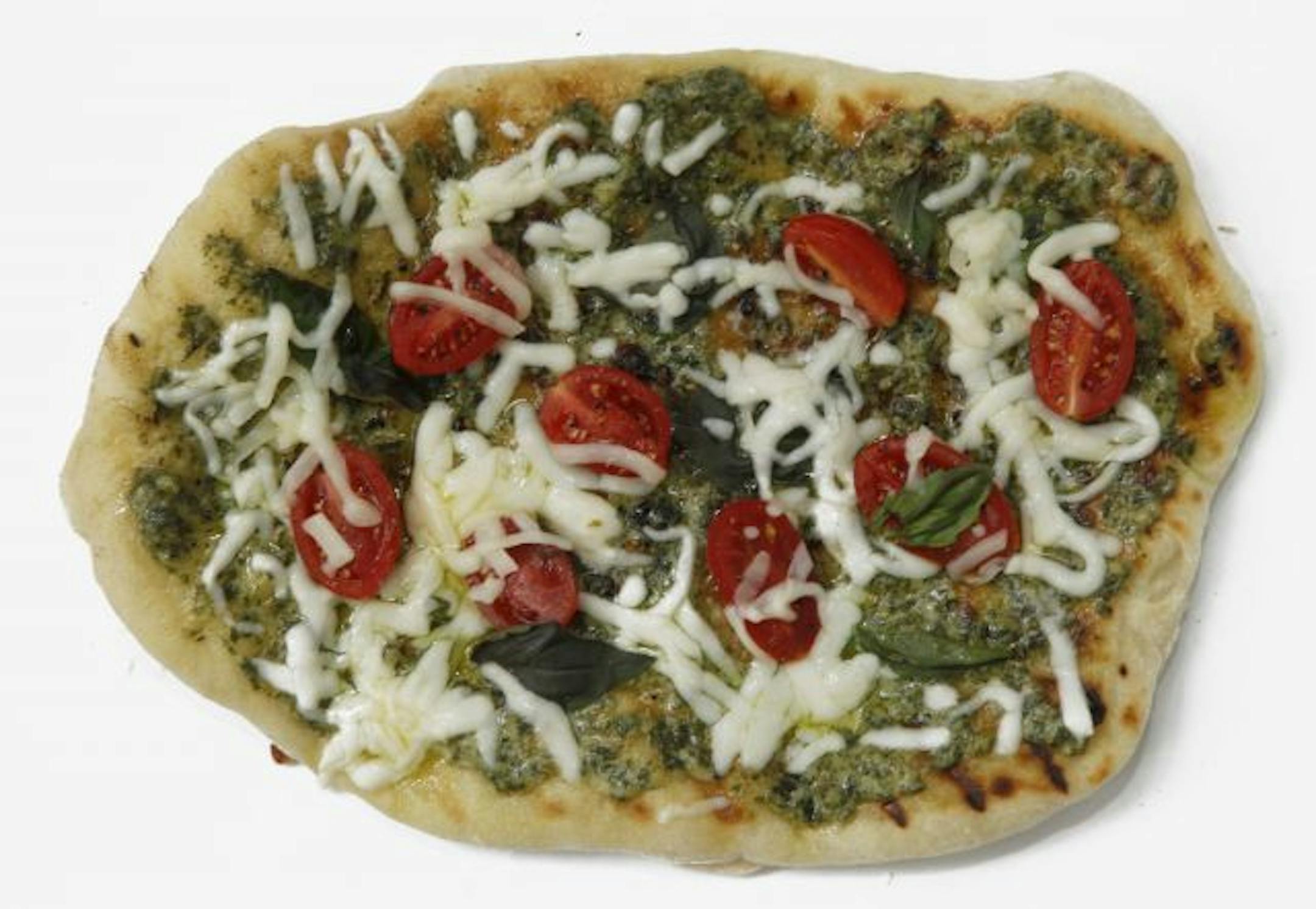 Pizza with pesto (instead of red sauce), cherry tomatoes and mozzarrella.