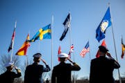 Leadership representing Norfolk-based NATO headquarters salute as the Swedish flag is raised outside of NATO Allied Command Transformation in Norfolk,