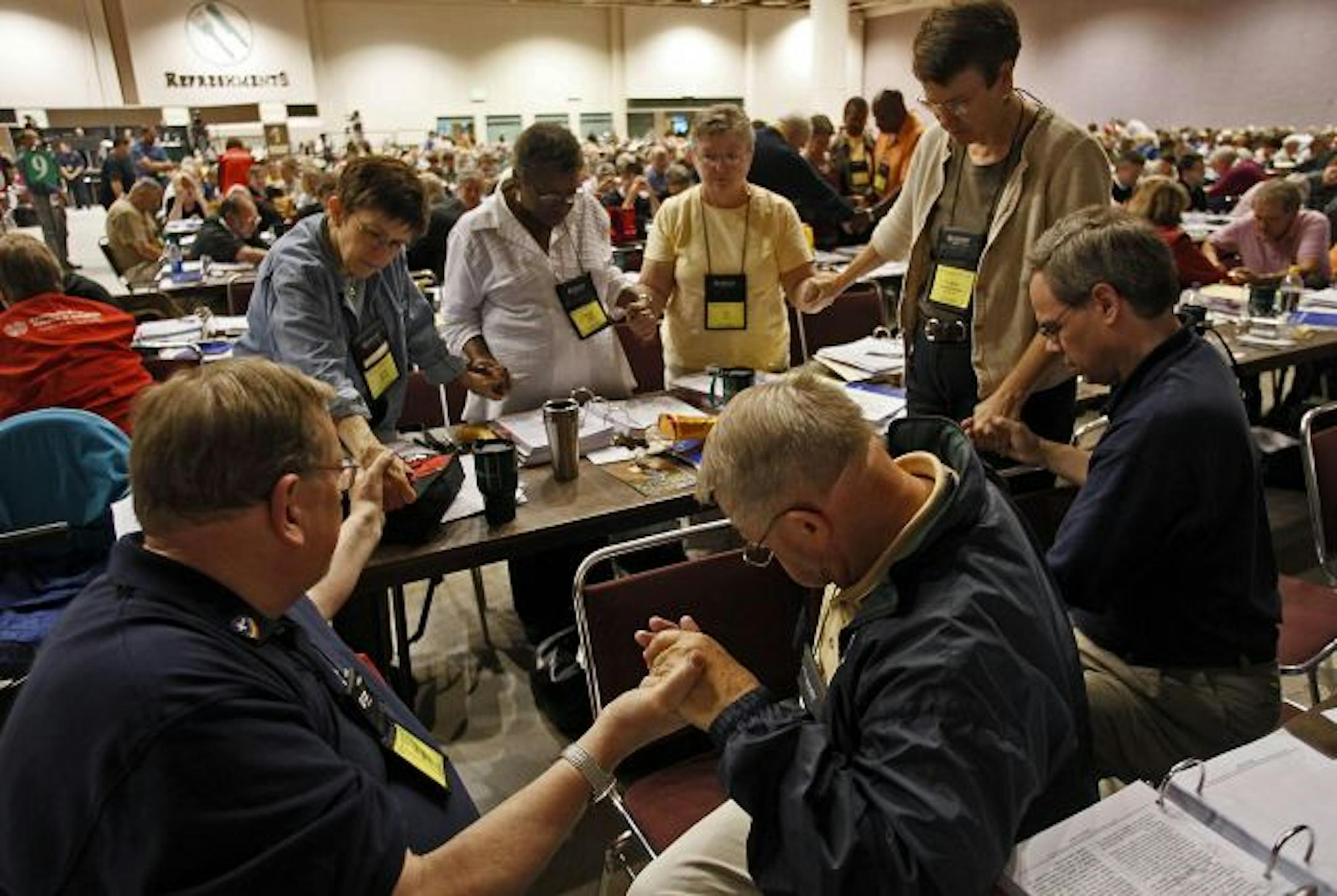 Members prayed together for understanding just after the yes vote was taken and approved on the same sex ammendment.