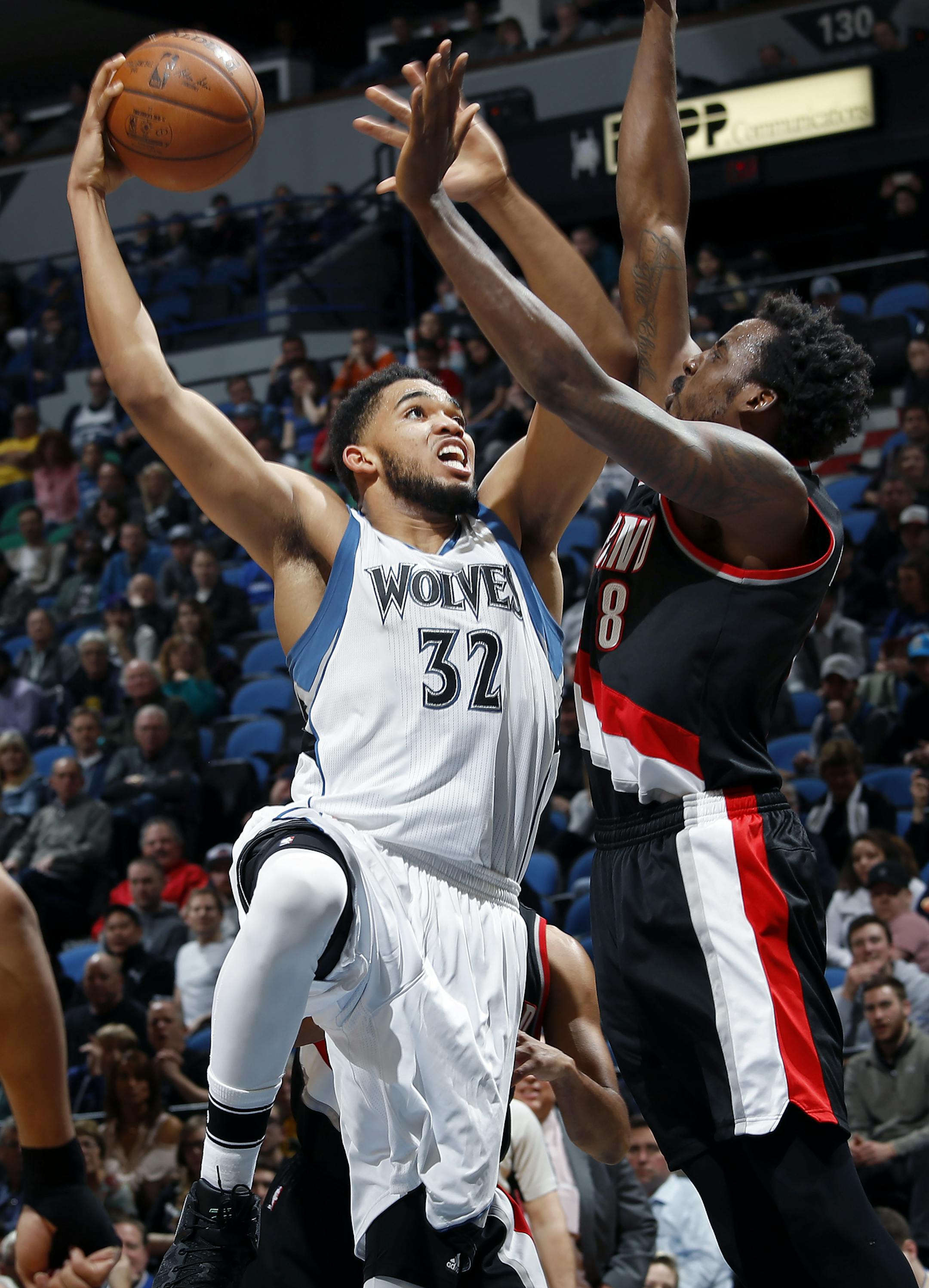 Karl-Anthony Towns (32) was defended by Al-Farouq Aminu (8) in the fourth quarter. ] CARLOS GONZALEZ ï cgonzalez@startribune.com - April 3, 2017, Minneapolis, MN, Target Center, NBA Basketball, Minnesota Timberwolves vs. Portland Trailblazers