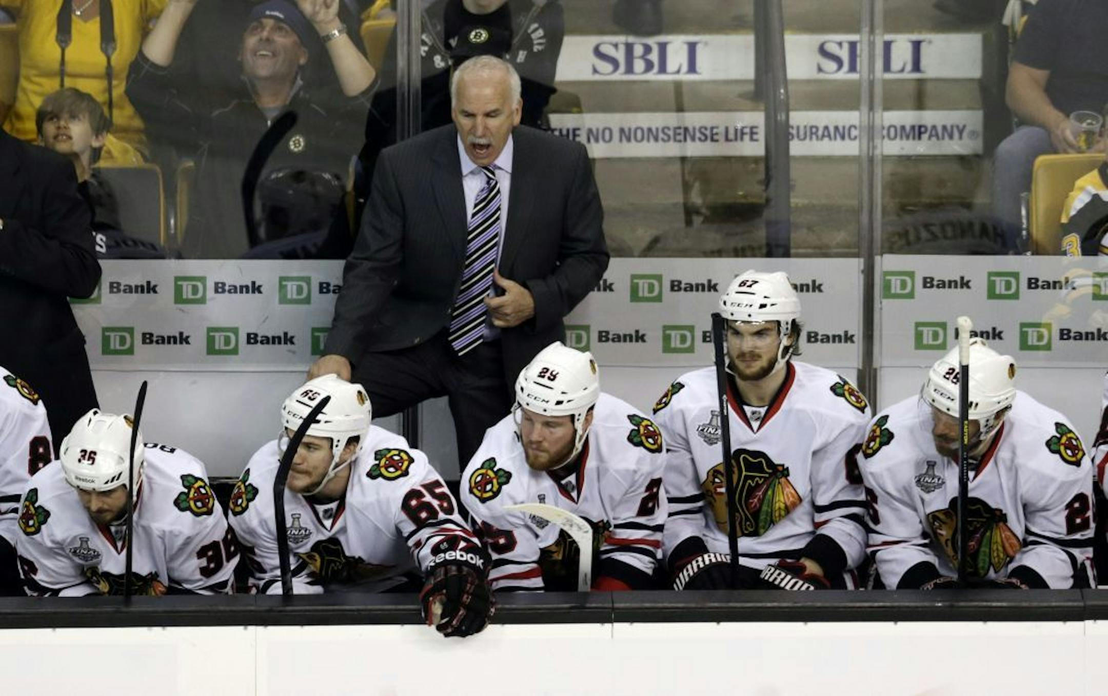 Chicago Blackhawks head coach Joel Quenneville shouts instructions to his team during the third period in Game 3 of the NHL hockey Stanley Cup Finals against the Boston Bruins in Boston, Monday, June 17, 2013.