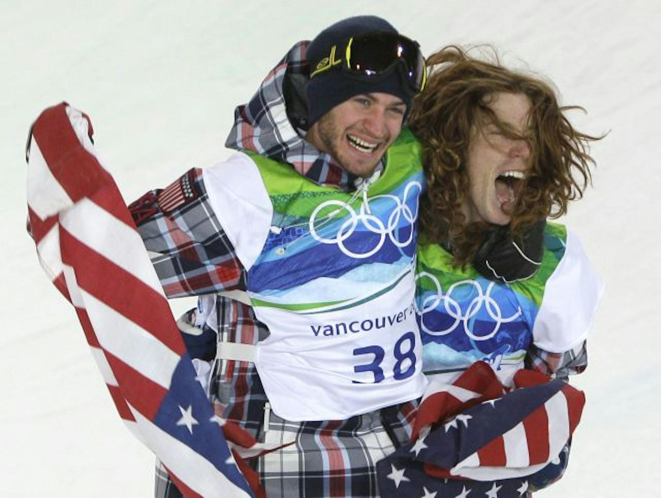 Olympic champion Shaun White of the USA, right celebrate with teammate and bronze winner Scott Lago of the USA after the men's snowboard halfpipe final at the Vancouver 2010 Olympics in Vancouver, British Columbia, Wednesday, Feb. 17, 2010.