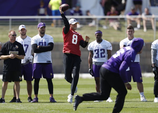 Minnesota Vikings quarterback Kirk Cousins (8) threw a pass during training camp at TCO Performance Center on Saturday in Eagan.