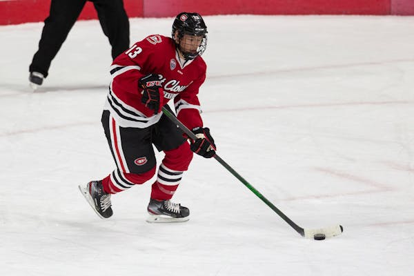 St. Cloud State forward Jami Krannila (13) moving the puck down the ice against the Western Michigan during an NCAA hockey game on Tuesday, Dec. 1, 20