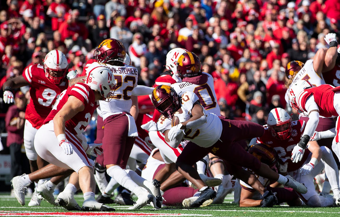 Minnesota's Mohamed Ibrahim (24) dives into the end zone for a touchdown against Nebraska during the second half of an NCAA college football game Saturday, Nov. 5, 2022, in Lincoln, Neb. (AP Photo/Rebecca S. Gratz)