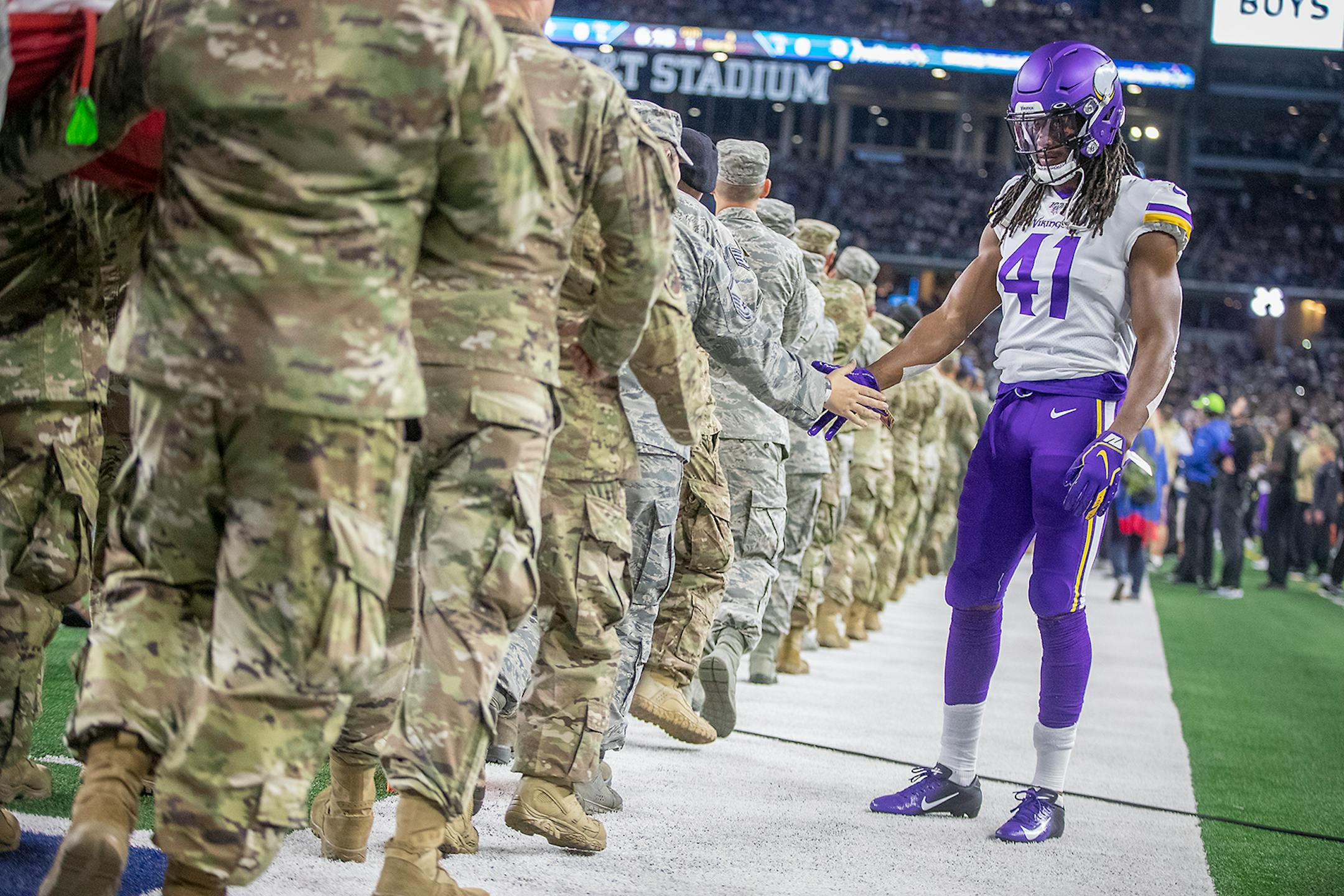 Vikings' defensive back Anthony Harris greeted service members as they made their way onto the field for the National Anthem before the game. ] ELIZABETH FLORES • liz.flores@startribune.com Vikings at Dallas Cowboys at AT&T Stadium, Sunday, November 10, 2019 in Arlington, TX.