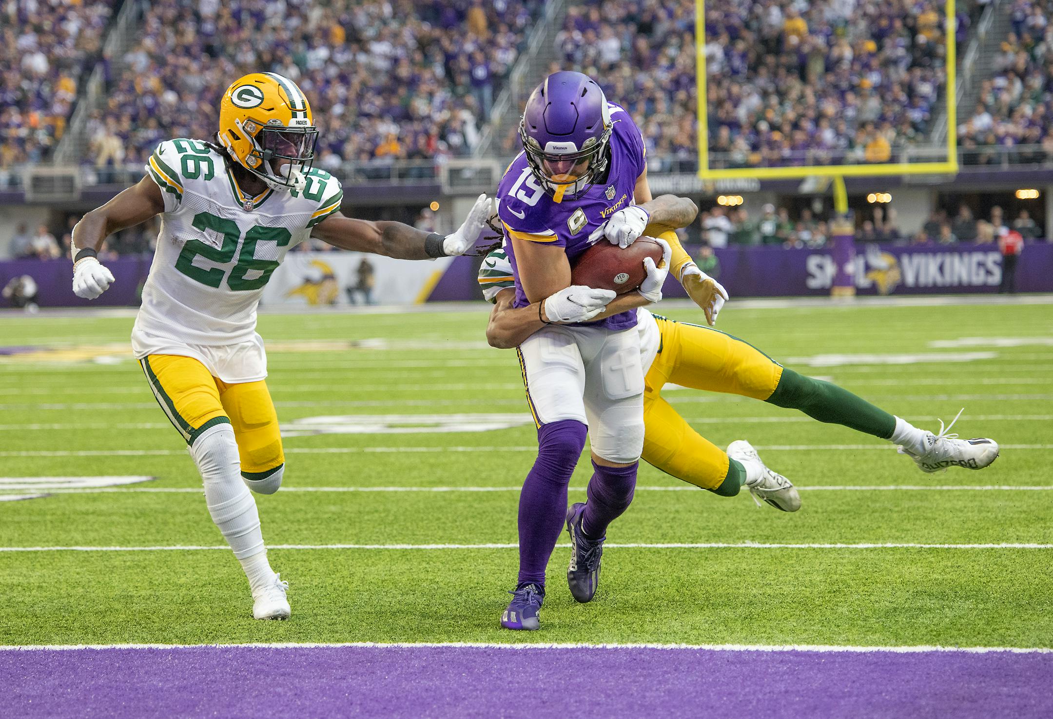 Vikings wide receiver Adam Thielen (19) plowed into the end zone for a touchdown during the second quarter.