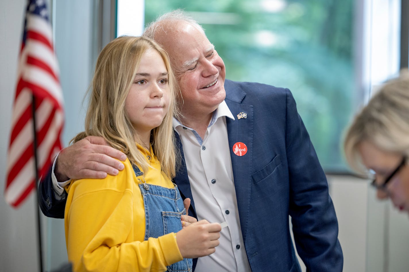 Gov. Tim Walz hugs his daughter Hope Walz after she cast her vote at the Ramsey County Elections Office in St. Paul on Monday.