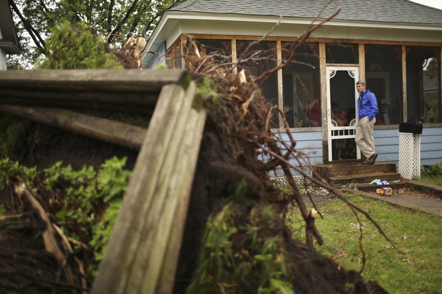 Minneapolis Mayor R.T. Rybak took to the streets of south Minneapolis Monday afternoon, June 24, 2013 to assess damage in some of the neighborhoods hit hardest by the recent storm. Minneapolis Mayor R.T. Rybak visited with Vaness Brom while she sat on her front porch Monday afternoon. There was a large tree in her front yard that came down in the storm on Friday and he was telling her that she could look at his Facebook page to find out more about what the city would be doing about removing fell