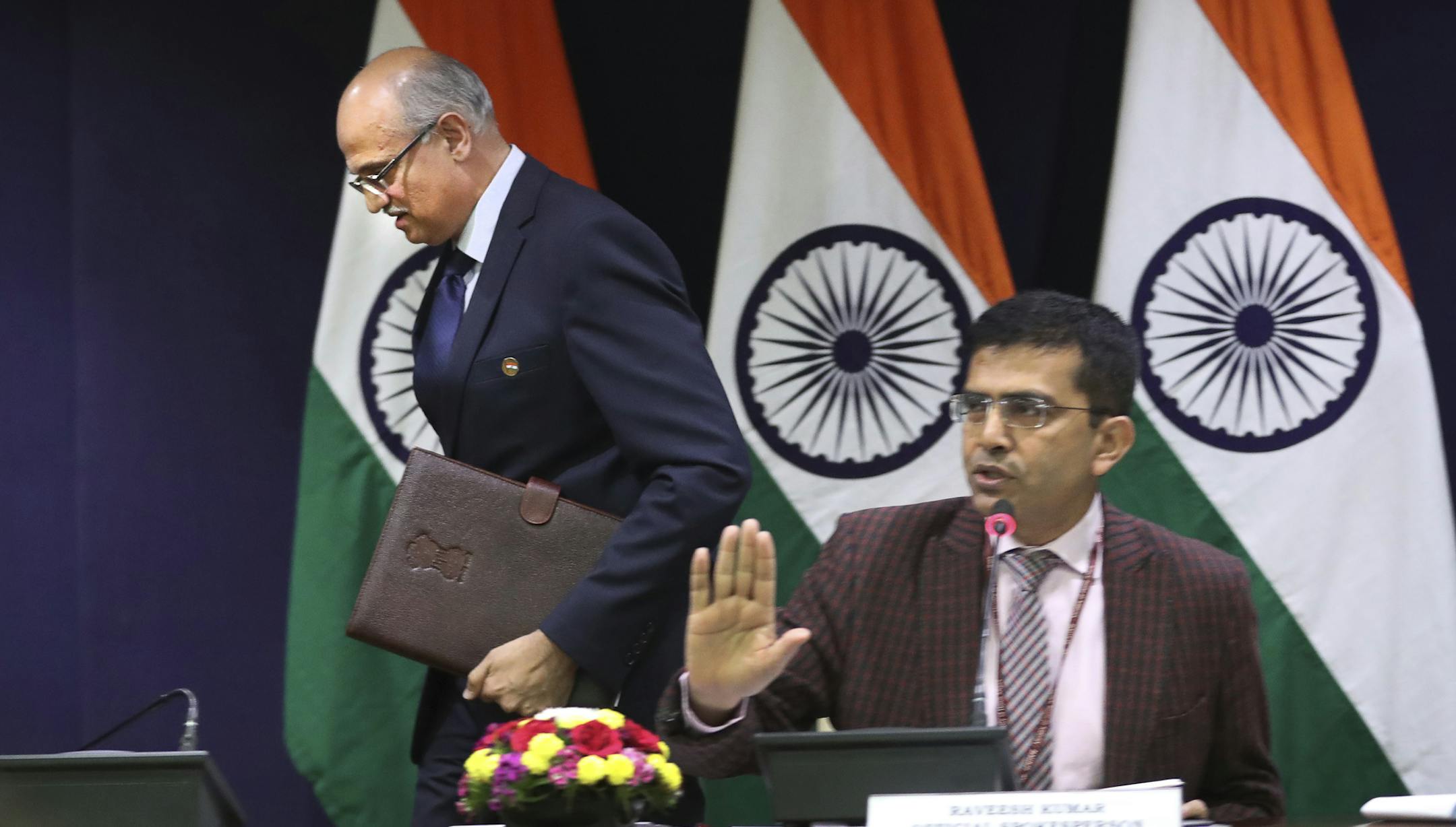 India's foreign ministry spokesperson Raveesh Kumar, right, refuses to entertain questions as foreign secretary Vijay Gokhale leaves after briefing the media about India’s air strikes in Pakistan at the Indian foreign ministry in New Delhi, India, Tuesday, Feb.26, 2019. Pakistan says Indian aircraft crossed into its territory and dropped bombs on Tuesday without causing casualties, in the latest escalation between the nuclear-armed rivals since a deadly attack on Indian troops in the disp