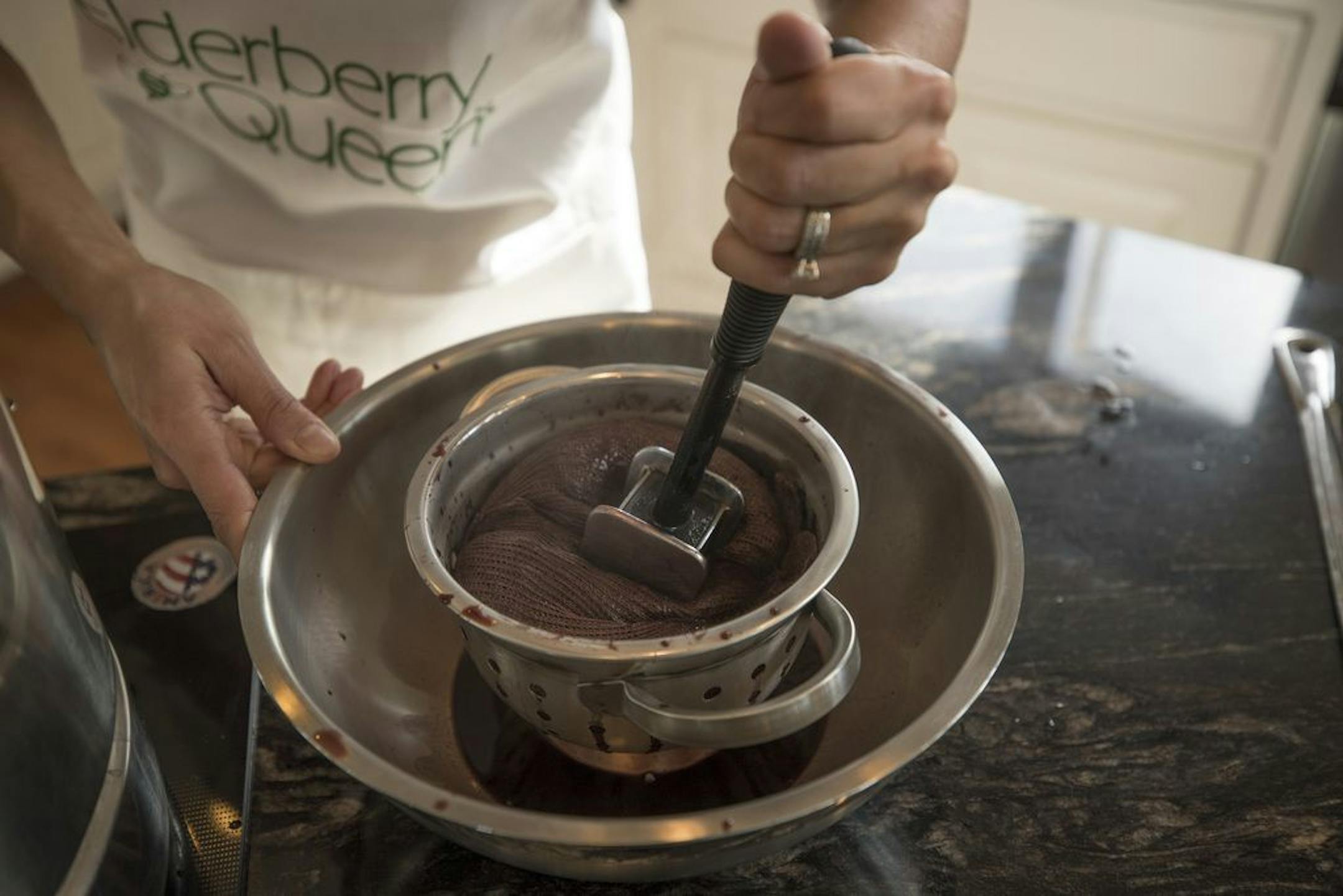 Lindsey Christianson, the "Elderberry Queen" made a batch of elderberry syrup in her home kitchen Wednesday Feb 28, 2018 in Ramsey, MN.