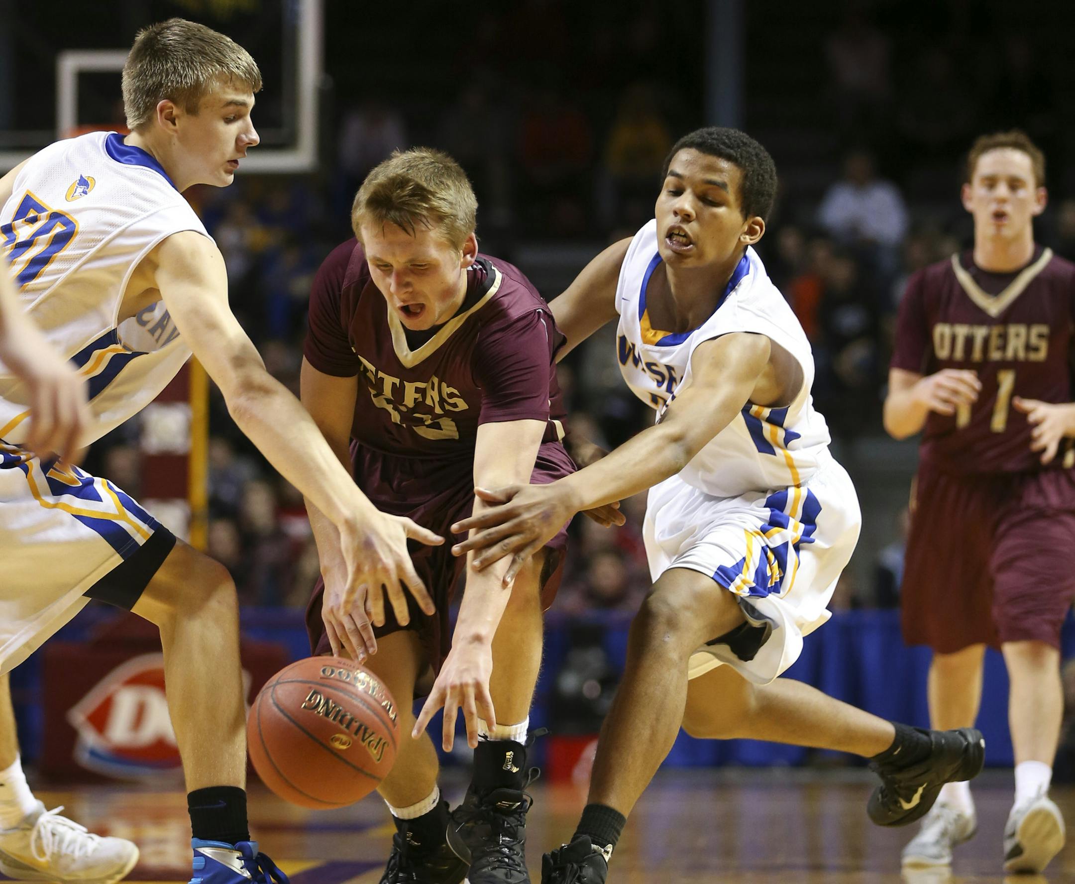 Waseca’s Elijah Carter, left, and Kaleb Nelson tried to take the ball away from Isaiah Lemke of Fergus Falls. (Jeff Wheeler, Star Tribune)