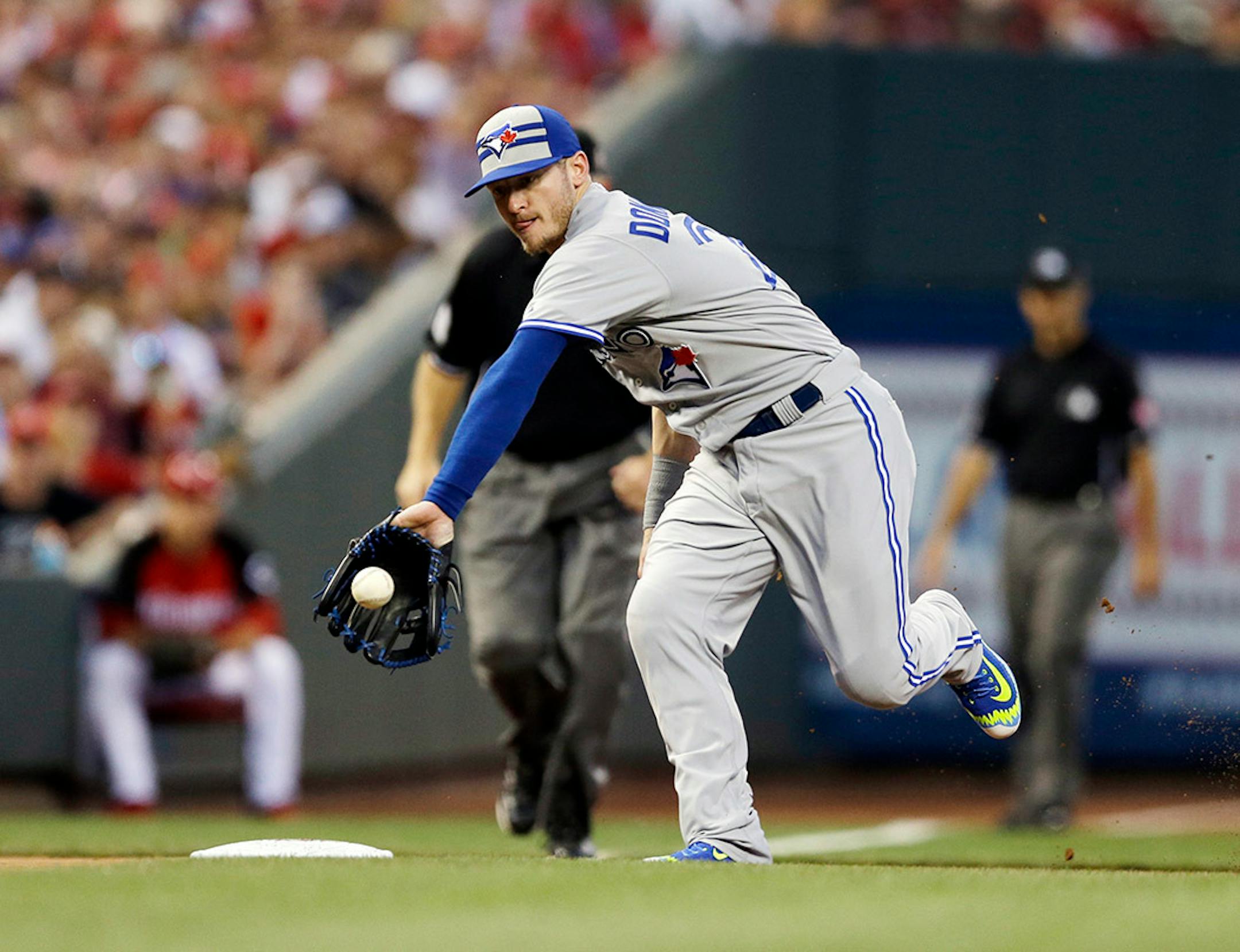 American League's Josh Donaldson, of the Toronto Blue Jays, makes a play on a ball hit by National League's Paul Goldschmidt, of the Arizona Diamonbacks, during the second inning of the MLB All-Star baseball game, Tuesday, July 14, 2015, in Cincinnati.