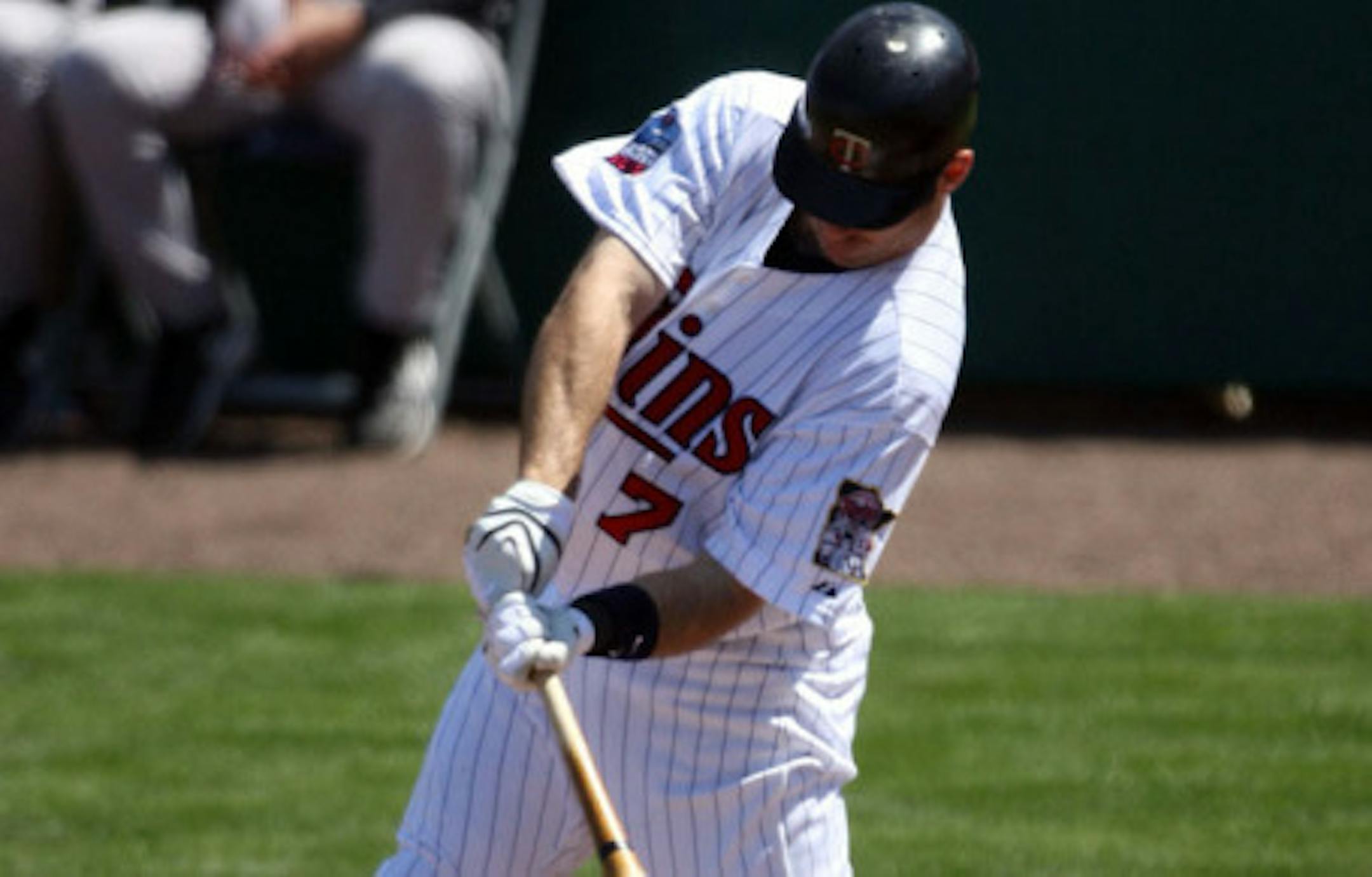 FORT MYERS, FL - MARCH 07:  Joe Mauer #7 of the Minnisota Twing hits a single against the New York Yankees at Lee County Sports Complex  on March 7, 2010 in Fort Myers, Florida.  (Photo by Marc Serota/Getty Images)