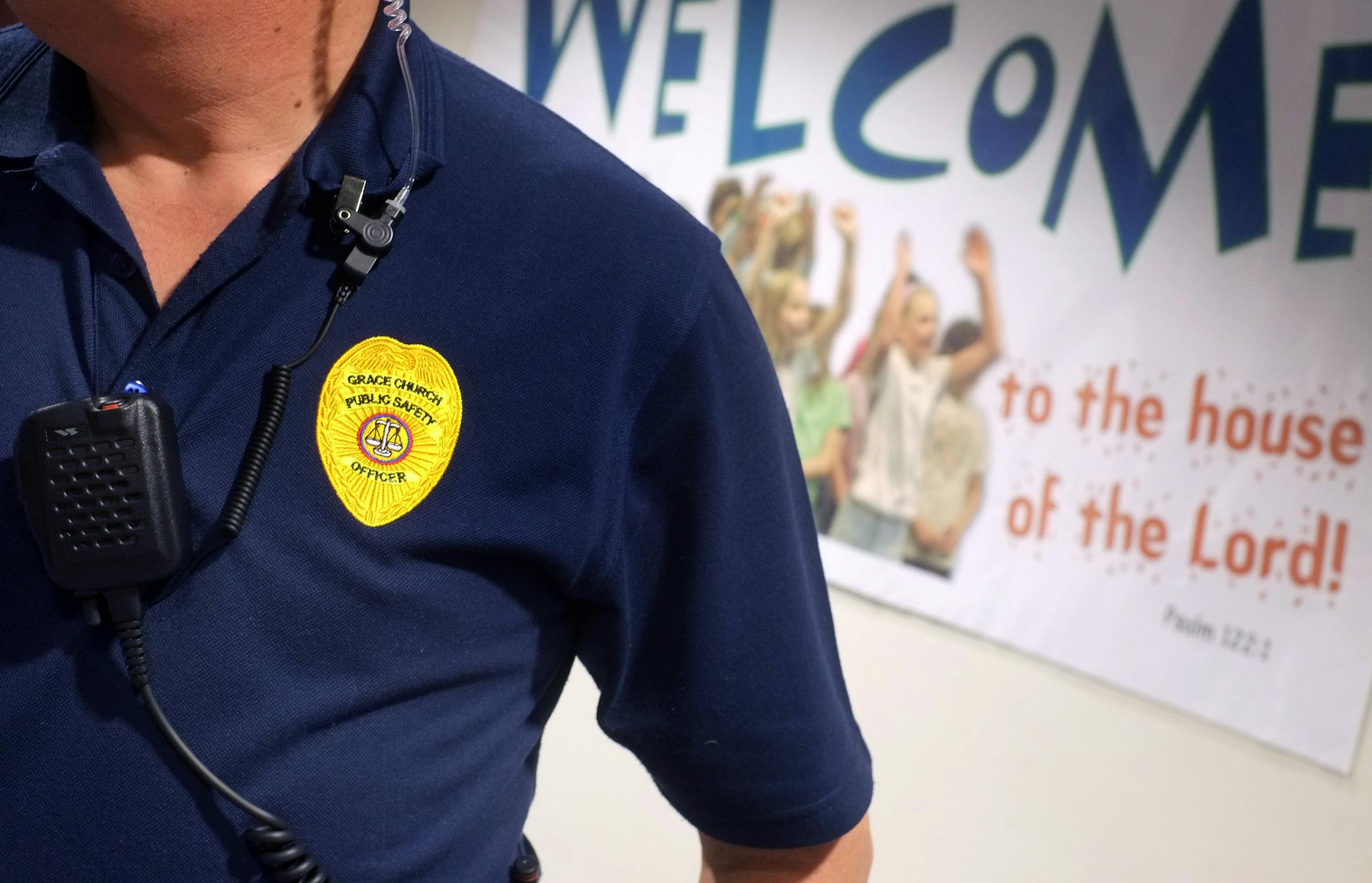 A security officer kept watch at Grace Church in Eden Prairie, which has close to 5,000 worshippers each Sunday.