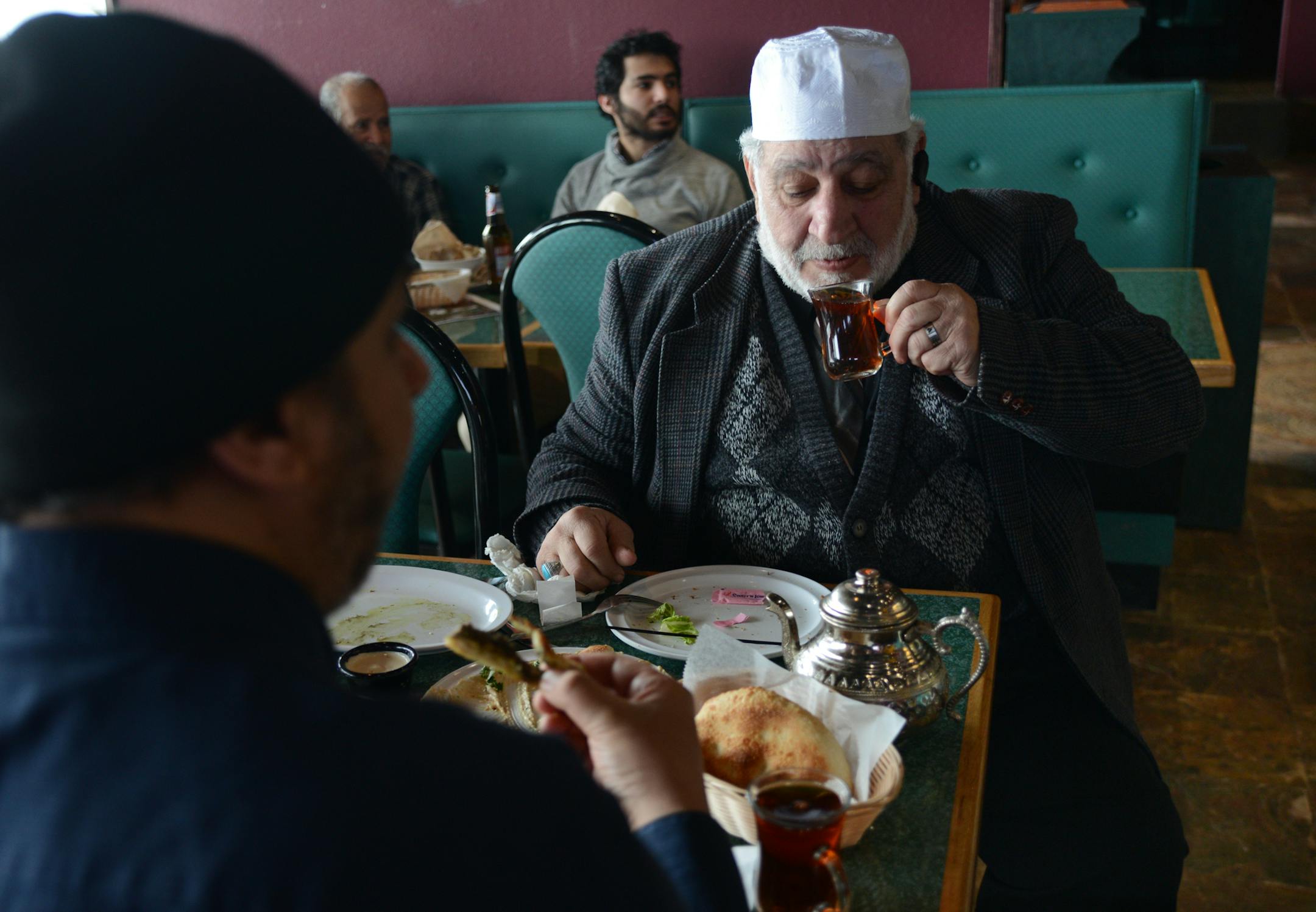 Passam Agha of Minneapolis sipped some tea at the Filfillah Restaurant features Middle Eastern food. ] Ethnic restaurants and grocery stores line Central Avenue in Columbia Heights, drawing community members and commuters alike to sample different cultures' cuisines. Richard.Sennott@startribune.com Richard Sennott/Star Tribune Columbia Heights , Minn. Tuesday 3/11/2014) ** (cq)