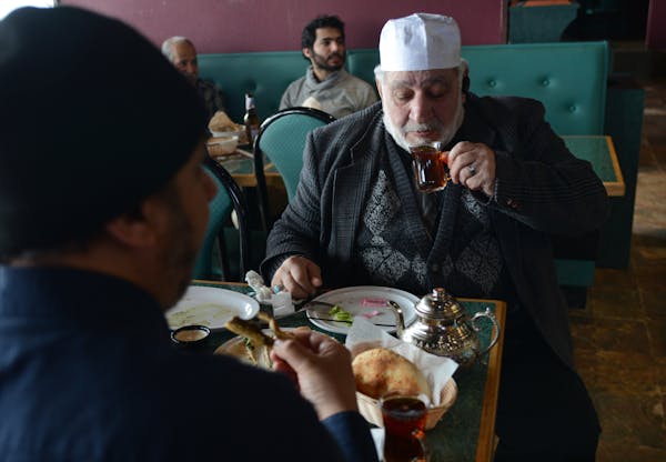 Passam Agha of Minneapolis sipped some tea at the Filfillah Restaurant features Middle Eastern food. ] Ethnic restaurants and grocery stores line Cent