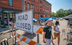 Cafe Astoria and Hope Breakfast Bar share a blocked off Leech Street in St. Paul as a pop-up pandemic patio on July 15. The popularity of the pop-up a