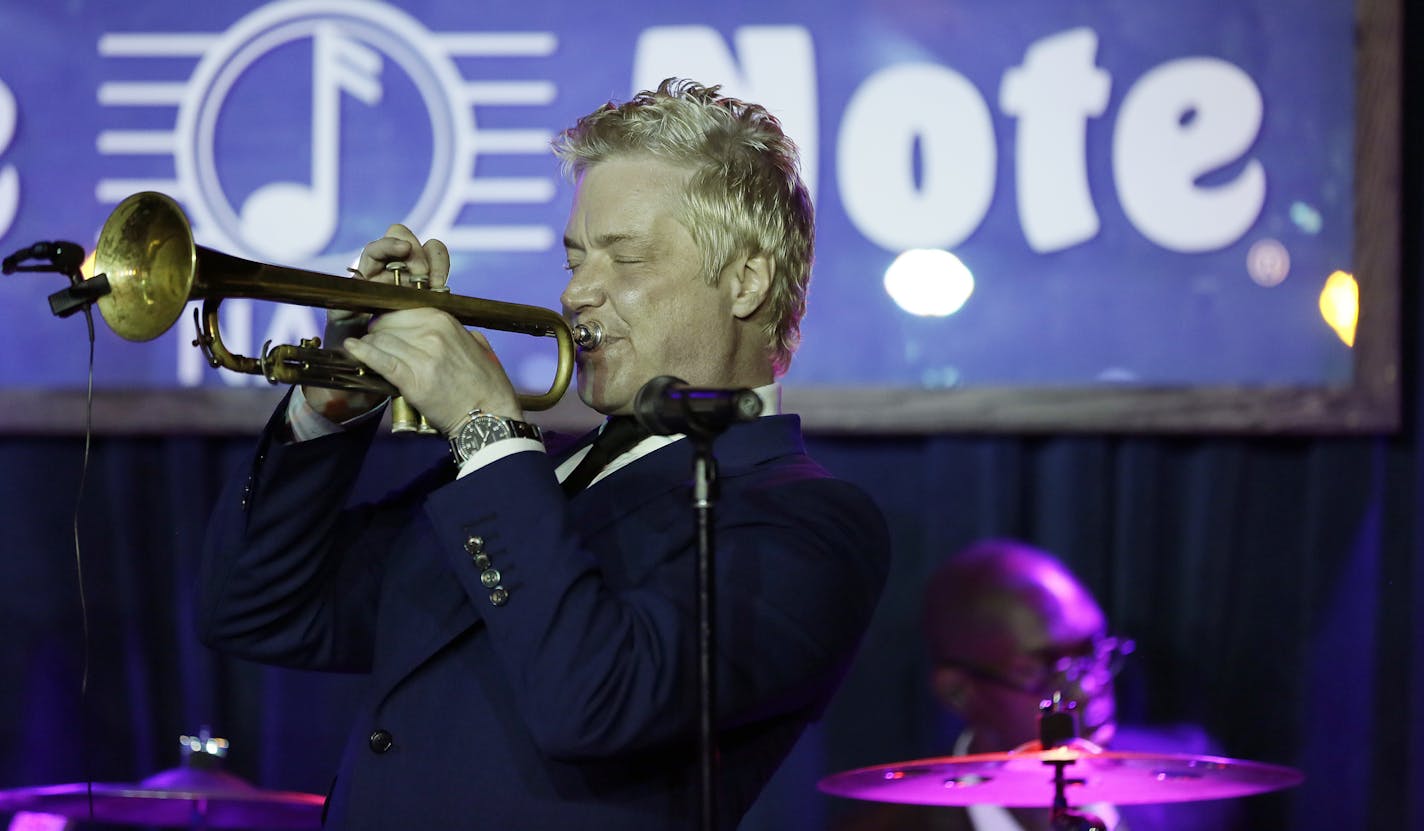 In this Tuesday, Oct. 25, 2016, photo, Chris Botti performs during the opening night of the Blue Note jazz club in Napa, Calif. The Napa venue is the newest location for Blue Note which began in New York City in 1981. On the drums at right is Lee Pearson. (AP Photo/Eric Risberg)