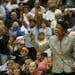 New Minnesota Lynx head coach Jen Gillom likes what she see against the Chicago Sky during 2nd quarter action of the Lynx season opener at the Target 