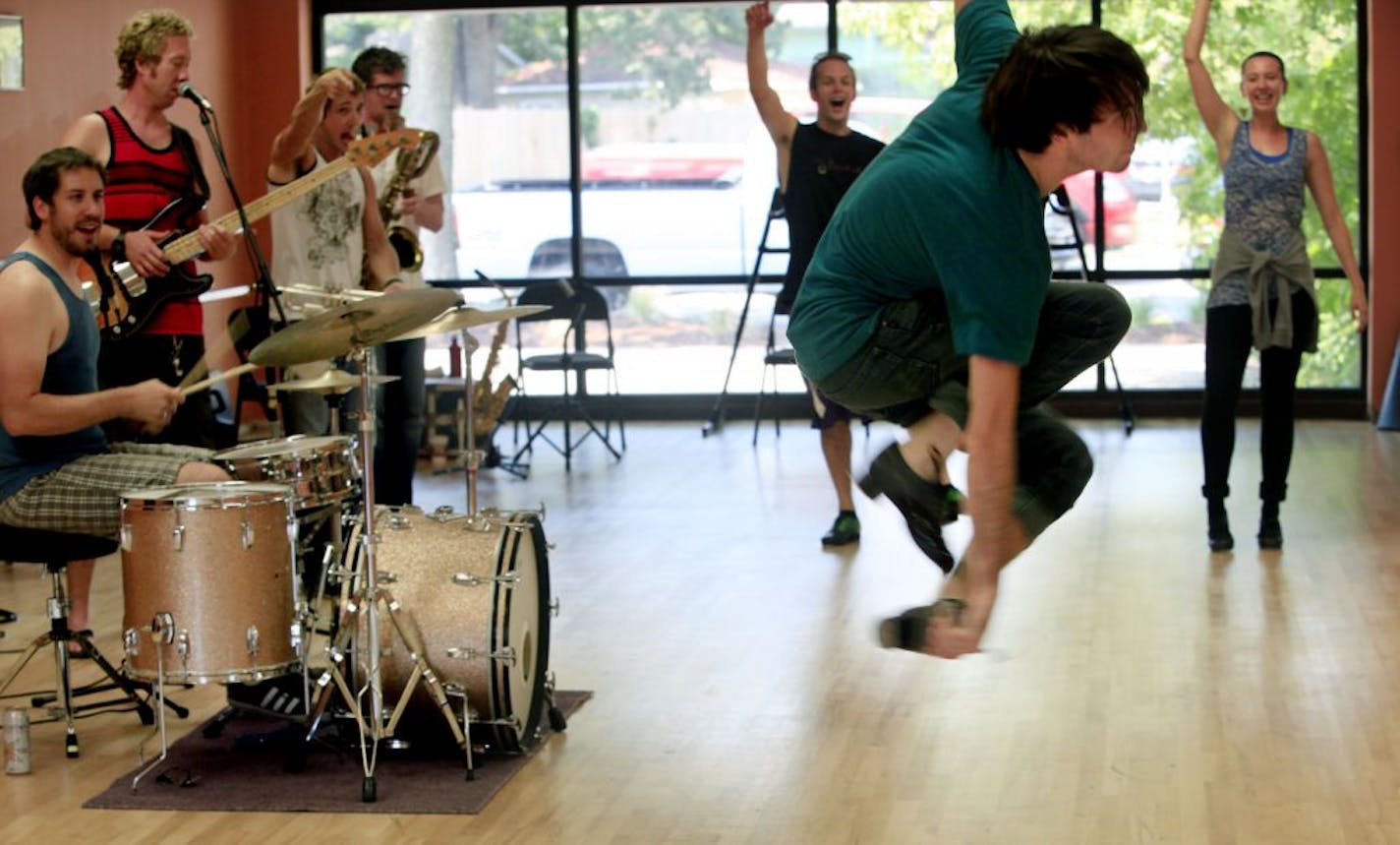 Galen Higgins, foreground, and fellow dancers Ricci Milan and Kaleena Miller practiced with band members Patrick Nelson (drums), Dan Ristrom (bass guitar), Aaron Weiner (trumpet) and Peter Vircks (saxophone).