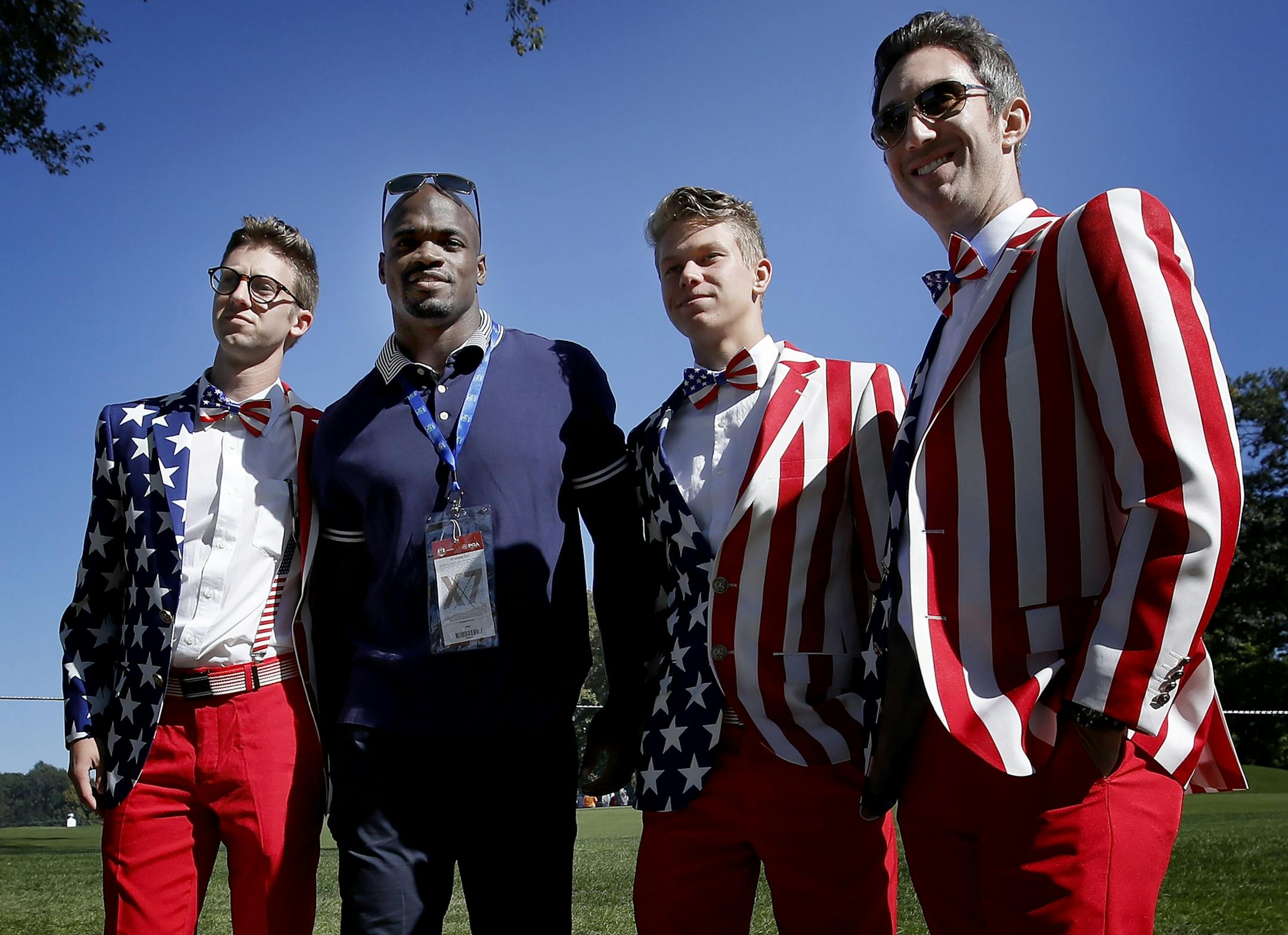 Minnesota Vikings running back Adrian Peterson posed with fans during the Ryder Cup at Hazeltine National Golf Club.