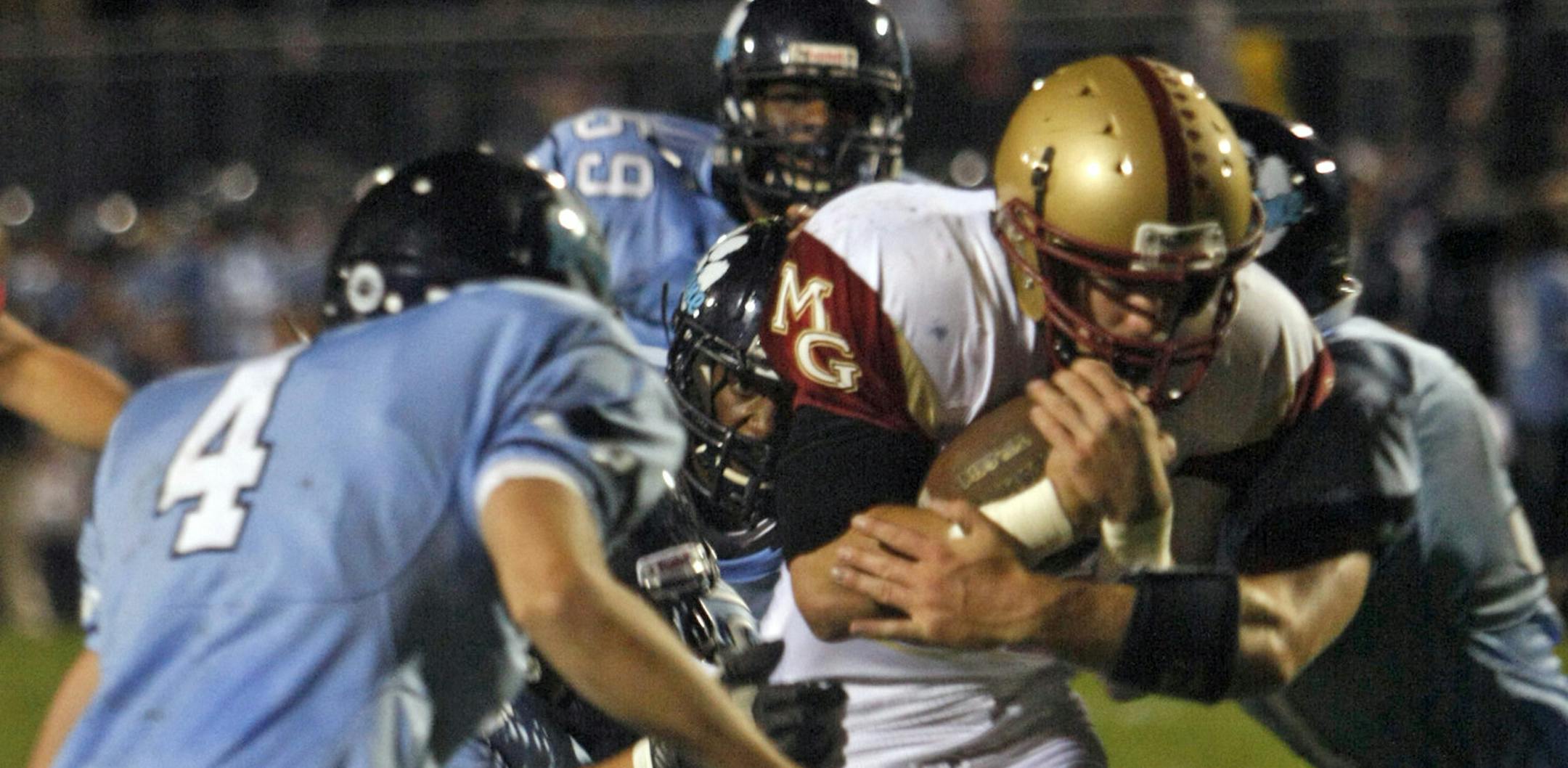Maple Grove teammates running back Clark Wieneke scores a touchdown at Blaine High School on Friday night. ] Chris Kelleher, Special to the Star Tribune, 9/20/2013, Blaine, MN.