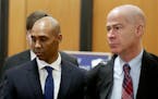 Former Minneapolis police officer Mohamed Noor, center, is accompanied by his attorneys Peter Wold, not pictured, and Thomas Plunkett, right, as he wa