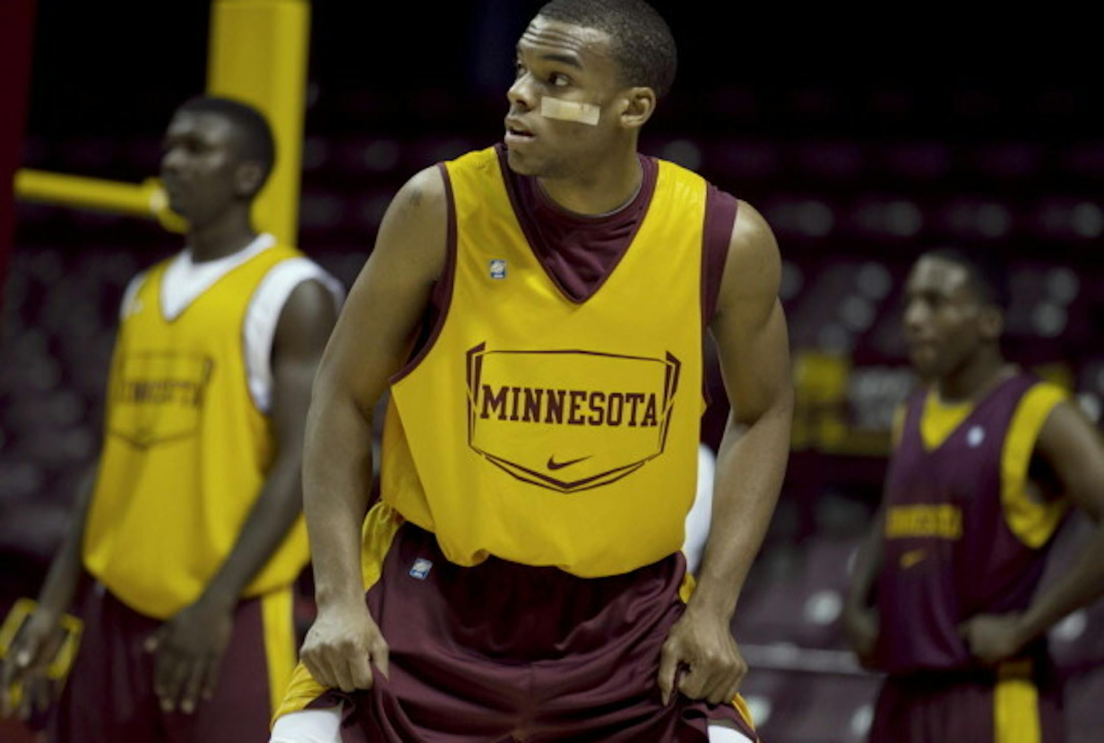 Andre Hollins, whose cheek was hurt diving for a ball, helps being a new toughness to the Gophers