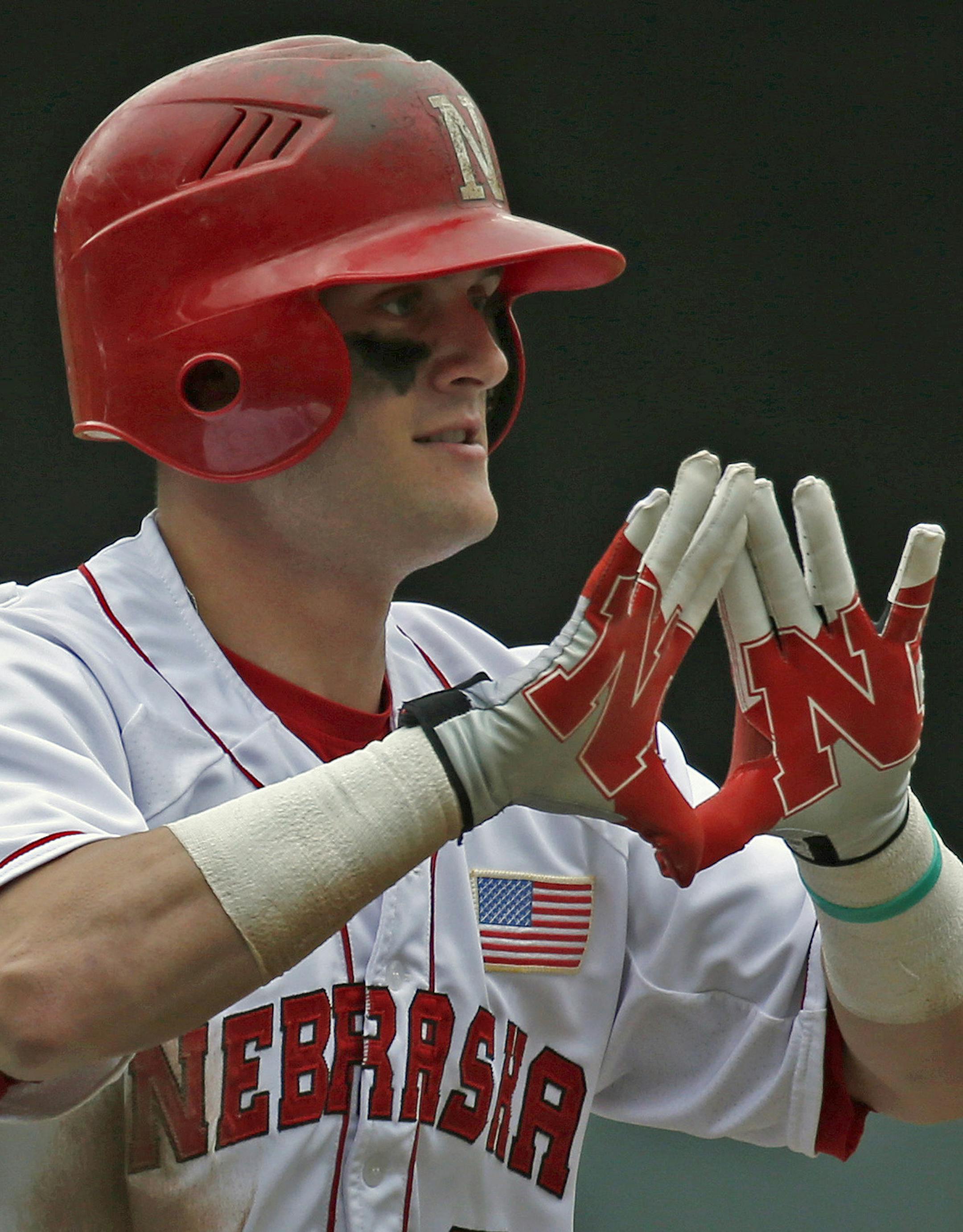 University of Minnesota vs. Nebraska, Big 10 Baseball Tournament, Target Field, 5/24/13. (left to right) Nebraska's Pat Kelly signaled his teammates, as he rounded the bases after hitting a three run home run in the 4th inning at Target Field.] Bruce Bisping/Star Tribune bbisping@startribune.com Pat Kelly/roster.