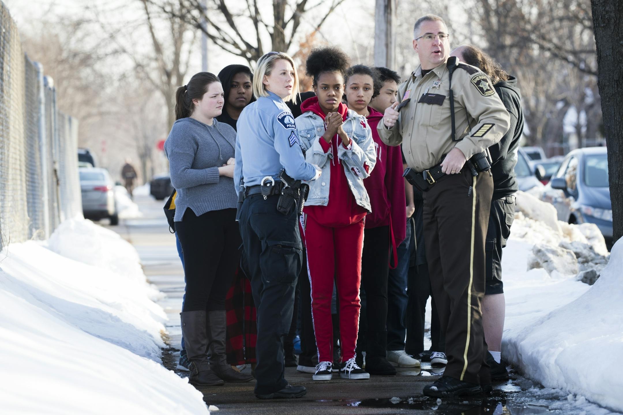 A group of students is evacuated from the school.