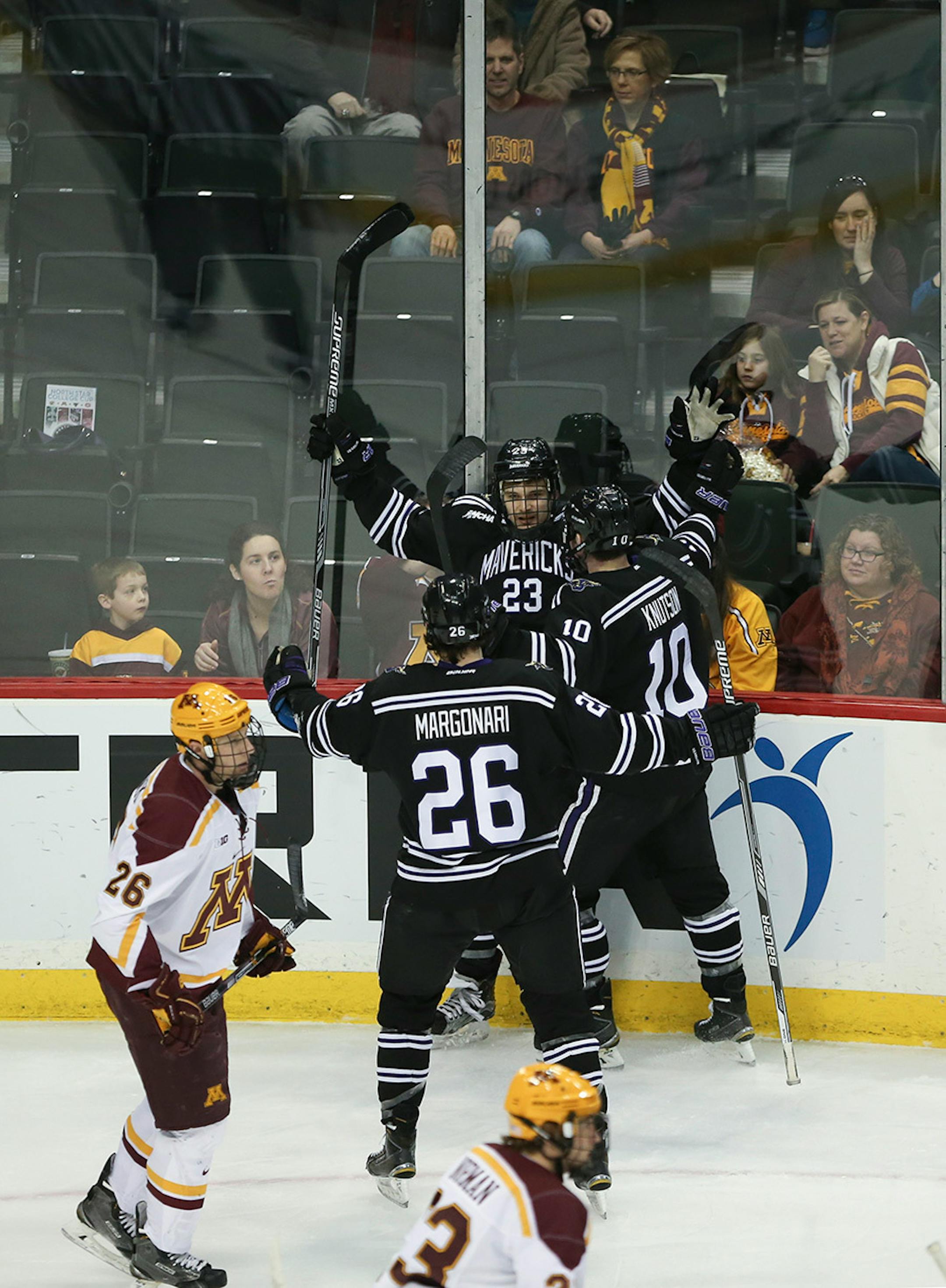 Mavericks forward Teddy Blueger (23) was congratulated on his first period goal by teammates Zeb Knutson (10) and Dylan Margonari (26) Sunday afternoon.