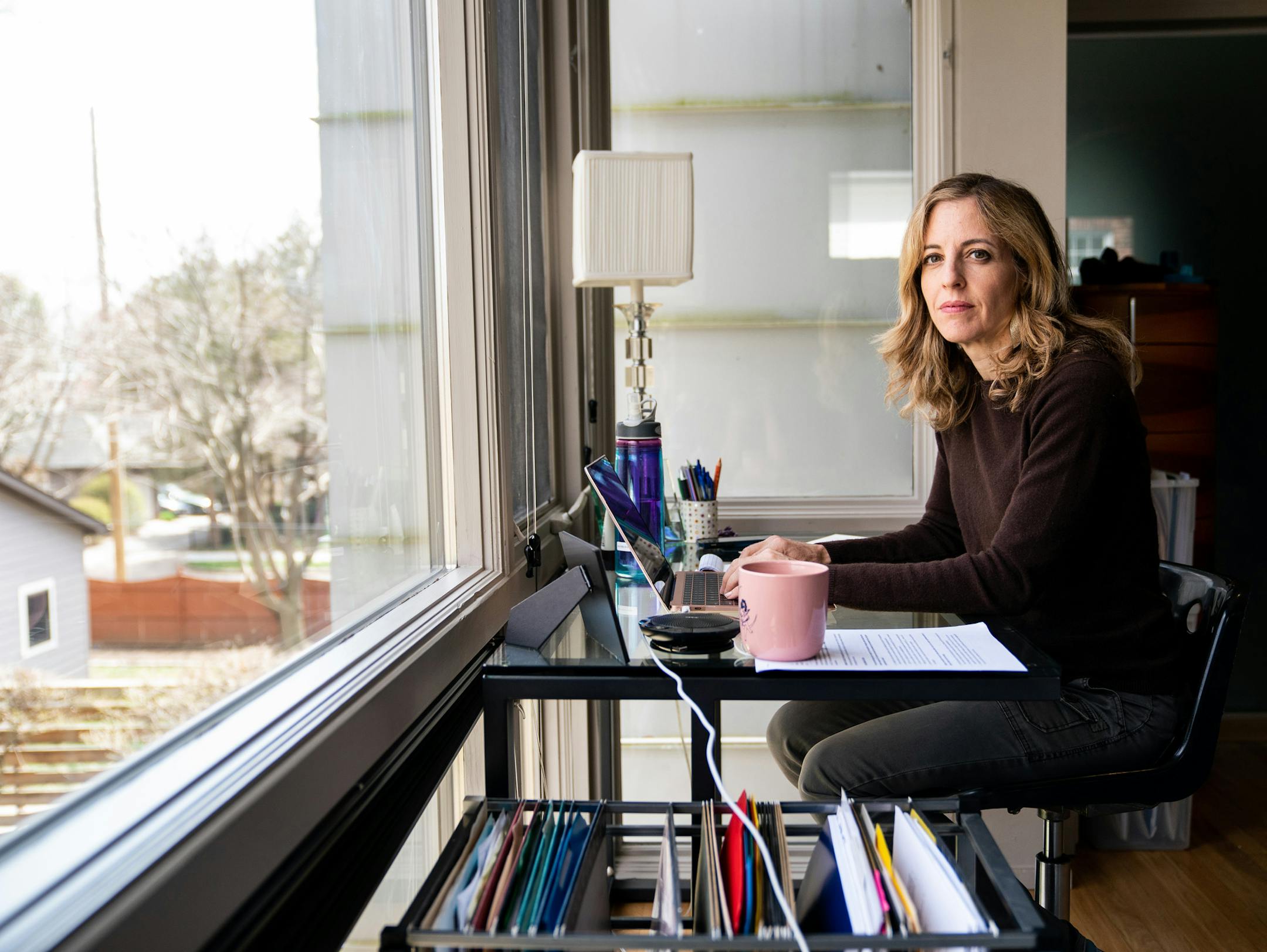Rachel Laser, the head of Americans United for Separation of Church and State, works from her home in Washington, March 17, 2020. “I like the physicality of leaving my space,” said Laser, who usually works in an office in downtown Washington. (Erin Schaff/The New York Times)