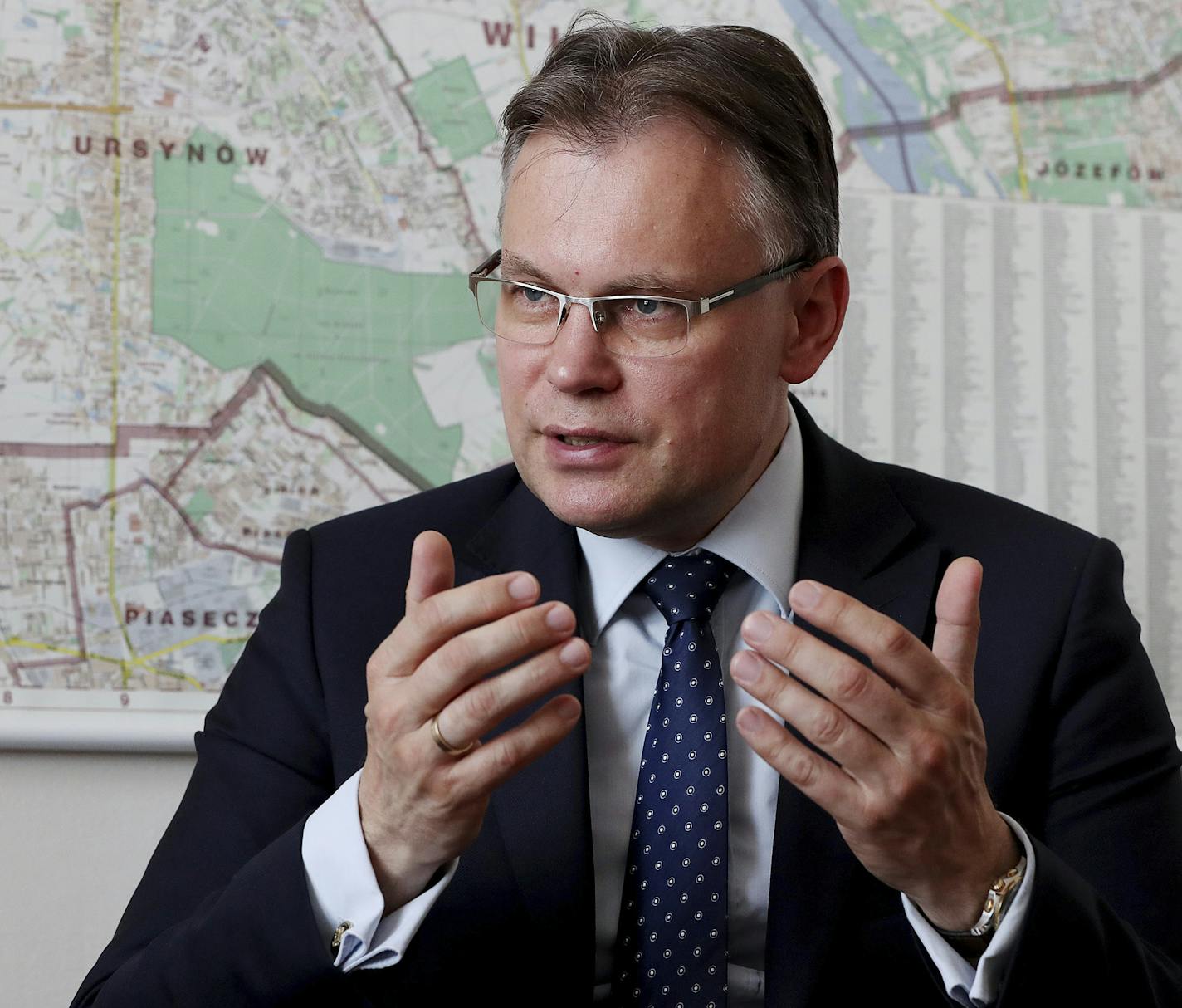 Poland's ruling party lawmaker Arkadiusz Mularczyk talks to The Associated Press in the parliament building in Warsaw, Poland, on Tuesday, May 21, 2019, about a report that assesses Poland's World War II losses and that, he says, will be given to German government. Contrary to Germany claims, Mularczyk says there are no documents or records suggesting that Poles has ever renounced its right to seek reparations from Berlin.(AP Photo/Czarek Sokolowski)