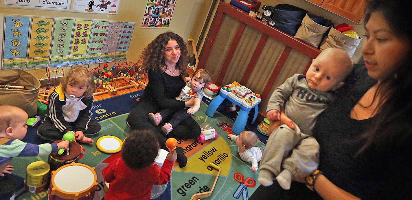 Erika Legros (right), and assistant to Luciana Carballo-Pierre (left), worked with children at Carballo-Pierre&#xcc;s 4-star rated, Minneapolis daycare home. ] JIM GEHRZ &#xd4; james.gehrz@startribune.com / Minneapolis, MN / April 9, 2015 /11:30 AM - BACKGROUND INFORMATION: At Crystal Born's daycare in Mankato, the toddlers don't spend all day watching TV. They work on their colors and numbers, and on Wednesday they had a scavenger hunt to help them learn their ABCs. That high-octane curriculum