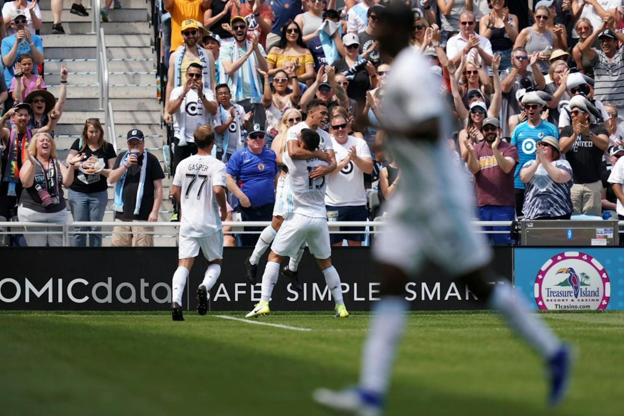 Minnesota United midfielder Hassani Dotson (31) was lifted up by Minnesota United defender Michael Boxall (15) after he scored in the first half.