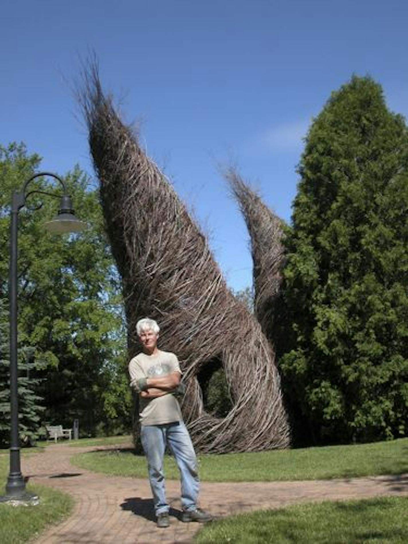 "Putting Two and Two Together" stick sculpture by Patrick Dougherty at the Woodson Art Museum in Wisconsin.