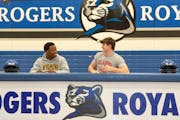 Adrian Onyiego and Wyatt Gilmoreon talk before they sign their letter of intent to play football at Wyoming and Oklahoma respectively on National Sign