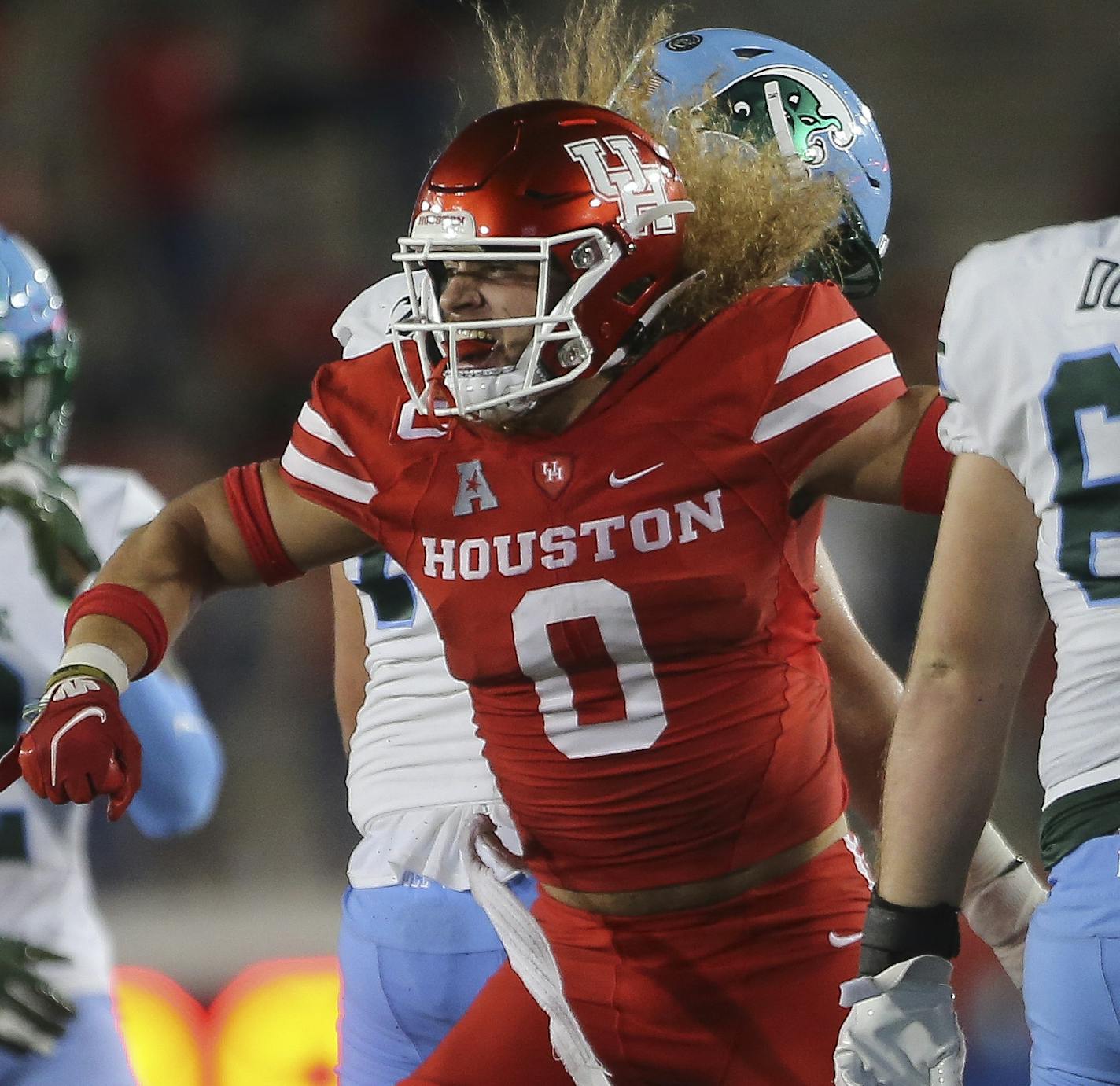 Houston linebacker Grant Stuard (0) celebrates a sack on Tulane quarterback Michael Pratt (7) during the second quarter of an NCAA college football game Thursday, Oct. 8, 2020, in Houston. (Yi-Chin Lee/Houston Chronicle via AP)