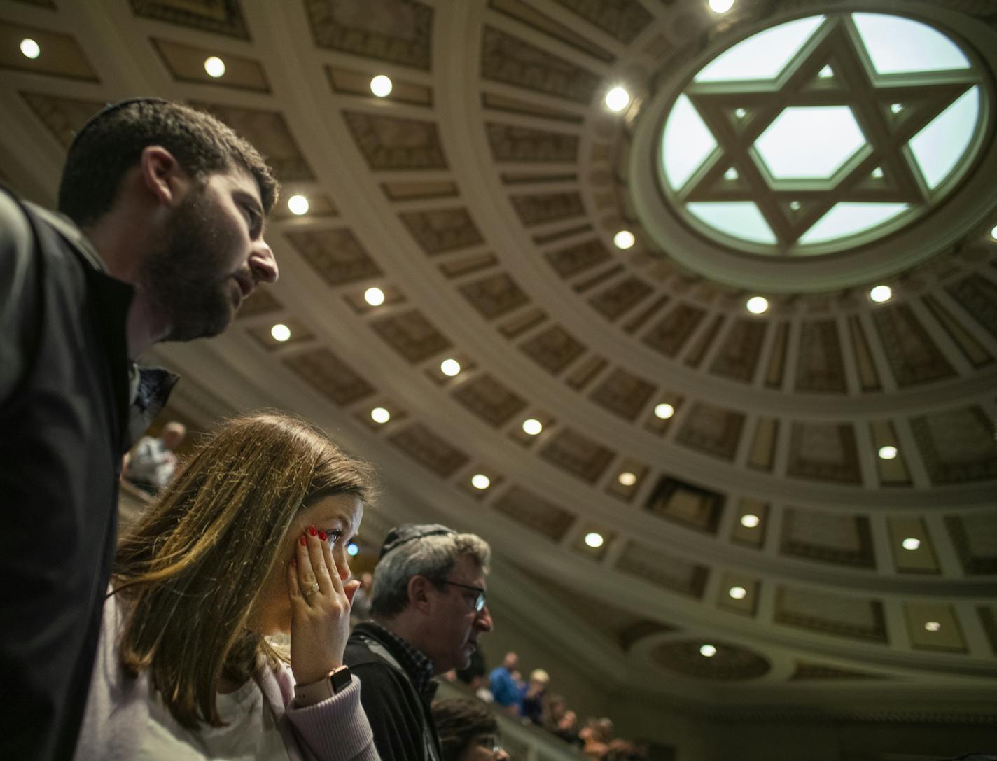 Mark and Allie Divine were among the many in the Twin Cities who gathered Sunday in memory of those killed and injured in Saturday's shooting at a Pittsburgh synagogue.