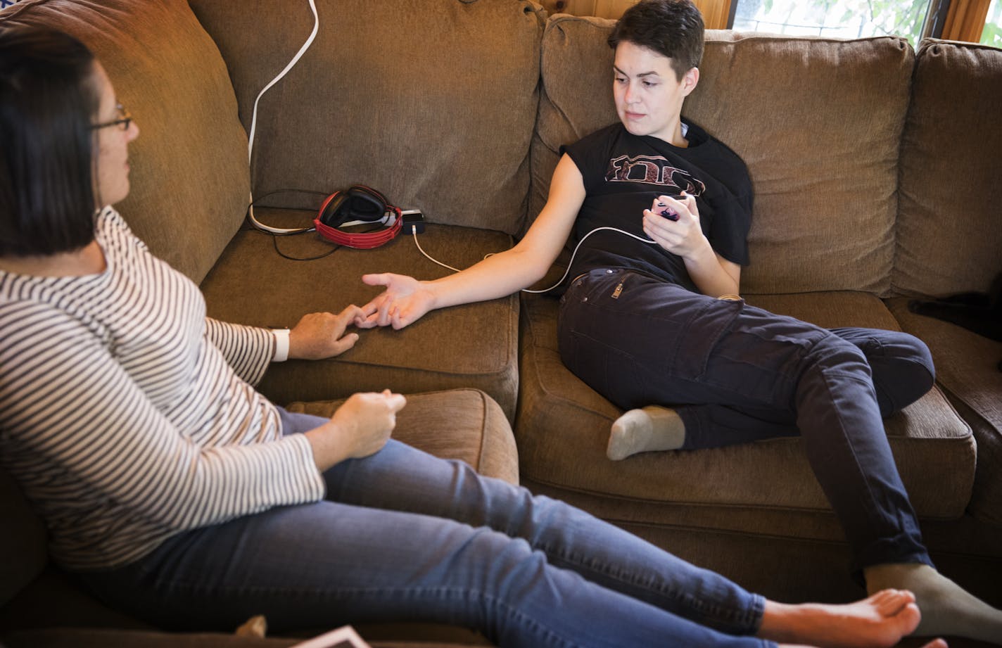 Gideon, right, talks with his host mother Carolyn Anderson. ] LEILA NAVIDI &#xef; leila.navidi@startribune.com BACKGROUND INFORMATION: Tuesday, September 5, 2017. Gideon, 22, was living in a homeless shelter in Anoka for six months before being placed in Jeff and Carolyn Anderson's home in Andover through the Anoka Communities Host Home Program. Gideon has now started community college and is adjusting well to family life. YMCA of the Greater Twin Cities has started a home host program in Anoka