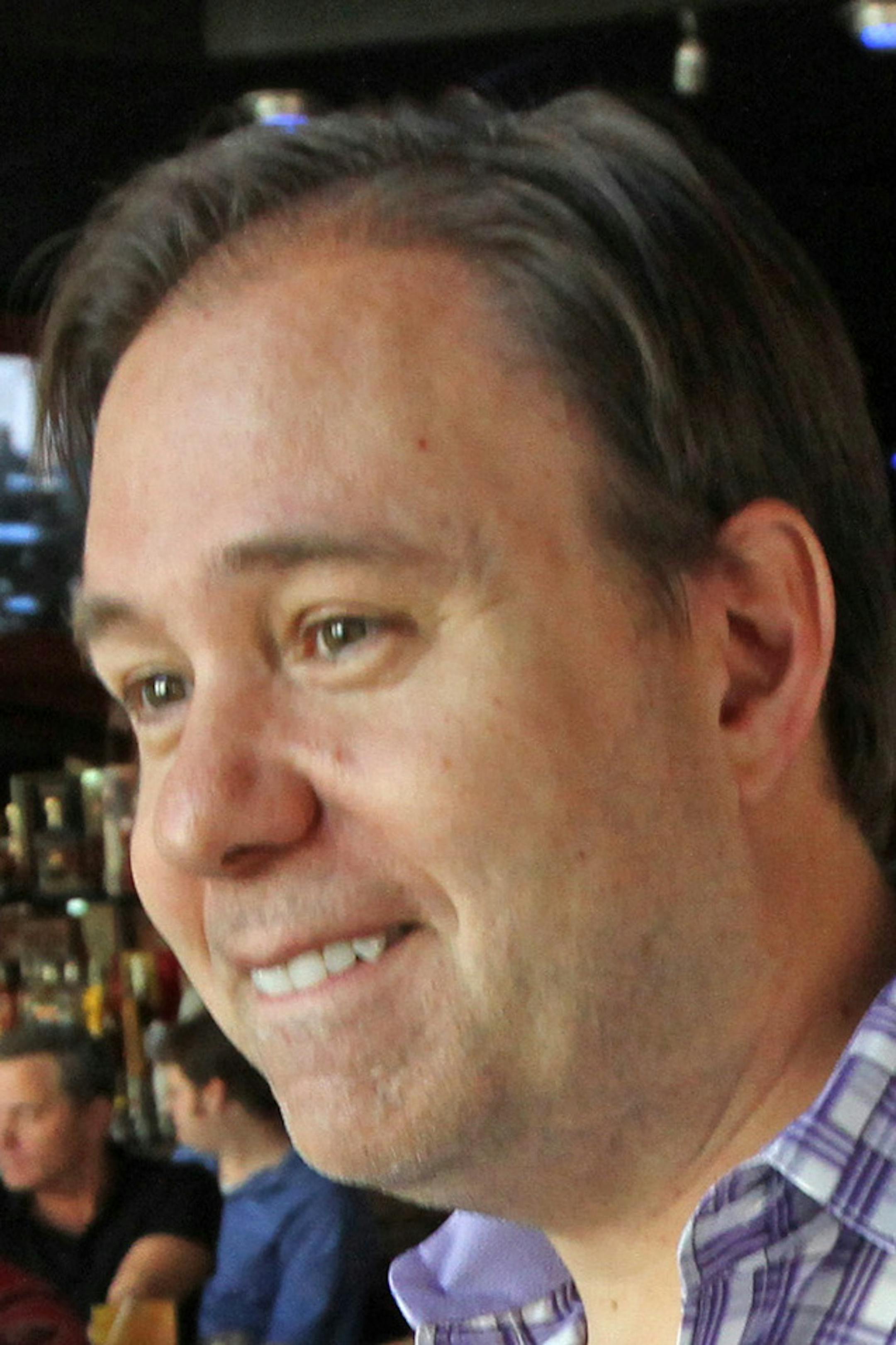 Charchian of Leaguesafe.com talked with some of the 400 to 500 people attending a fantasy football camp at Sneaky Pete’s in downtown Minneapolis on 8/18/12. He was talking during a commercial break on the radio show he was doing live at the bar, which was packed with fans of fantasy football.] Bruce Bisping/Star Tribune bbisping@startribune.com Paul Charchian/source. ORG XMIT: MIN1208181541331203