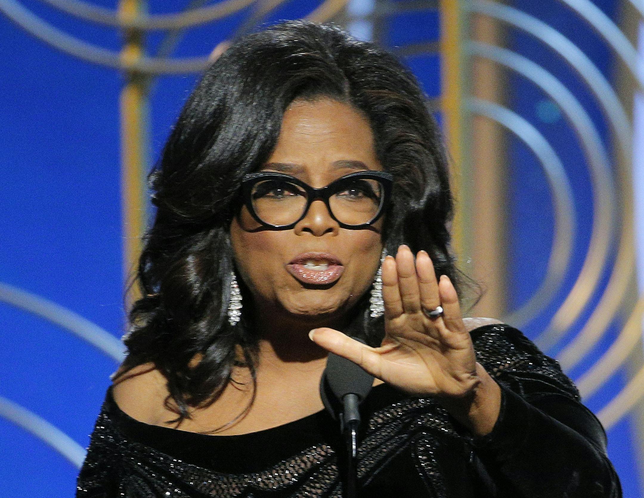 This image released by NBC shows Oprah Winfrey accepting the Cecil B. DeMille Award at the 75th Annual Golden Globe Awards in Beverly Hills, Calif., on Sunday, Jan. 7, 2018. (Paul Drinkwater/NBC via AP)