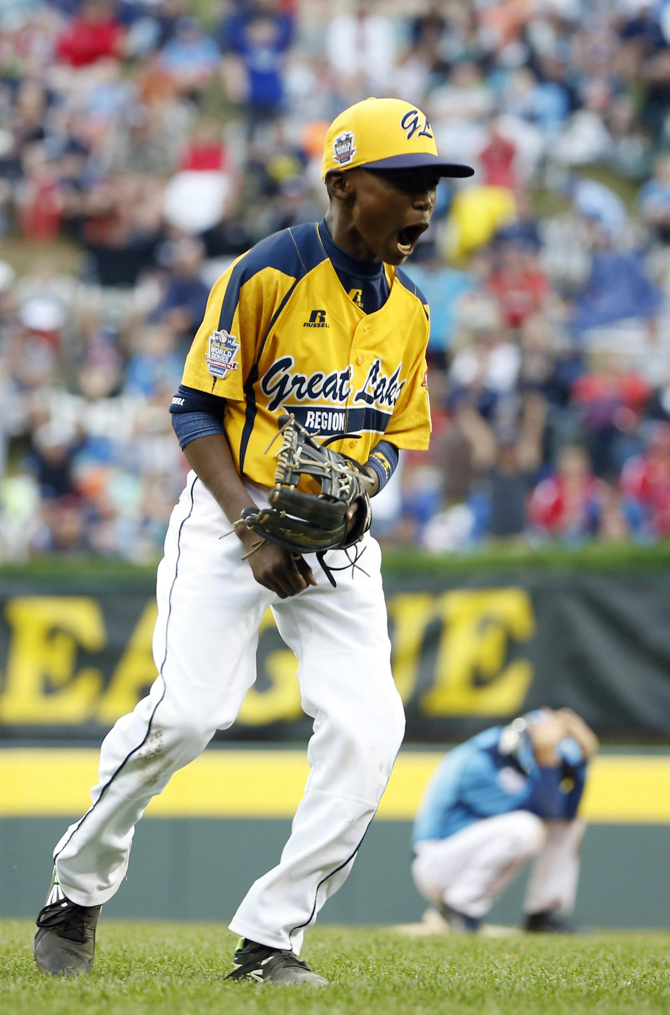 Chicago’s Ed Howard celebrates after Chicago defeated Las Vegas 7-5 in the U.S. Championship baseball game at the Little League World Series, Saturday, Aug. 23, 2014, in South Williamsport, Pa.(AP Photo/Matt Slocum)
