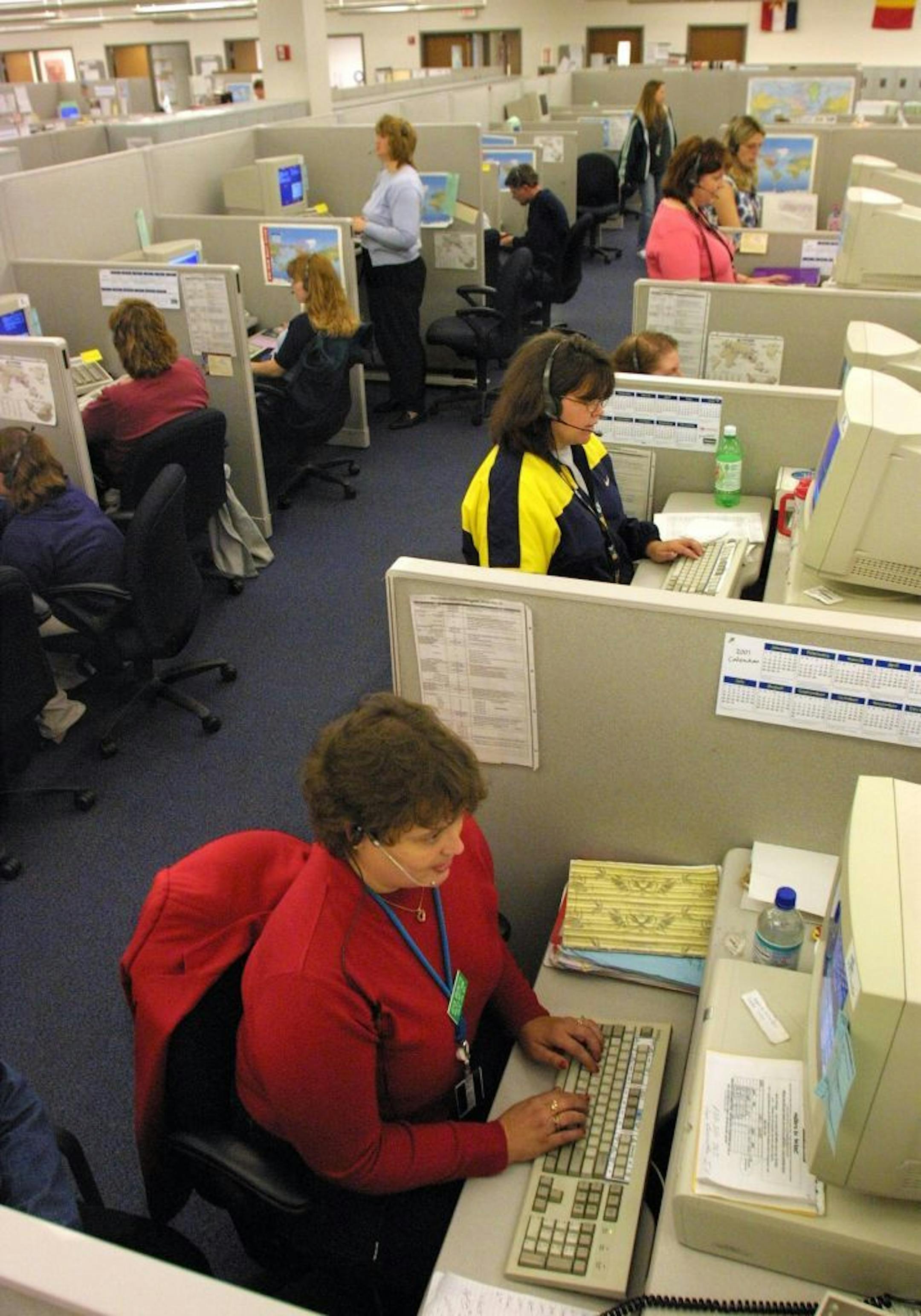 Reservationists, including Joyce Burnette in the foreground, log travel reservations into computers at Northwest Airlines reservations center in Chisholm. The Northwest facility represents the growth of the service industry on the Iron Range.