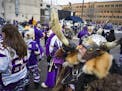 Greg Hanson blows his horn as part of his persona as the Norse god Odin. He likes to be known as "
Sir Odin. "] Story about tailgating and how it has 